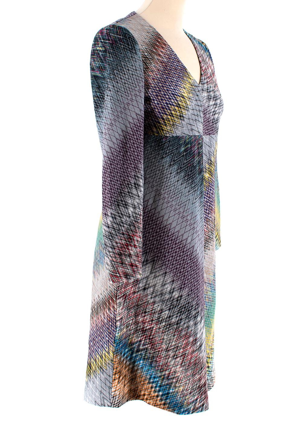 Missoni Patterned Paneled Long Sleeve Knit Dress

- Made of a soft knit 
- Signature chevron style pattern 
- Gorgeous multicolor hues 
- Classic cut 
- Long sleeve 
- V shaped neckline 
- Flared skirt 
- Zip fastening to the back 
- Cheerful