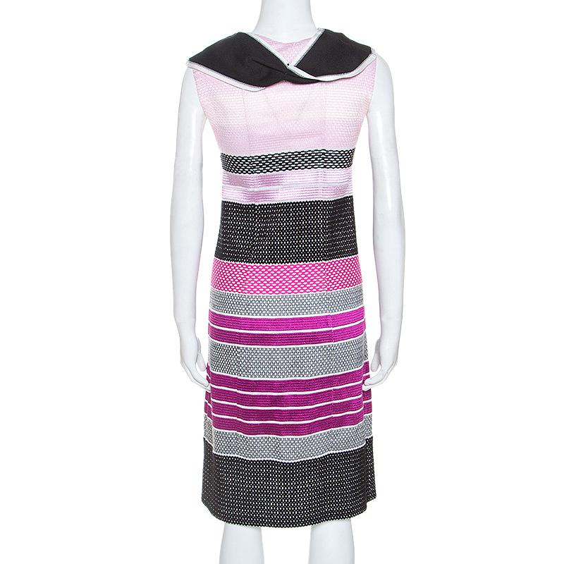 An example of fashionable designing, this attire is from Missoni. An ensemble in different shades like this will lend an uber-chic look. The sleeveless dress has a draped neckline, a comfortable fit and hemline ending at the knees.

