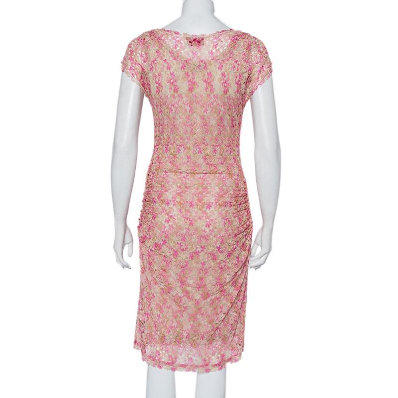 Choose this amazing outfit from Missoni for an upcoming outing. Style this pink & beige attire with gladiator sandals for an edgy look. Made in knit fabric, this dress is designed in a sleeveless style with a round neckline and ruched detailing.

