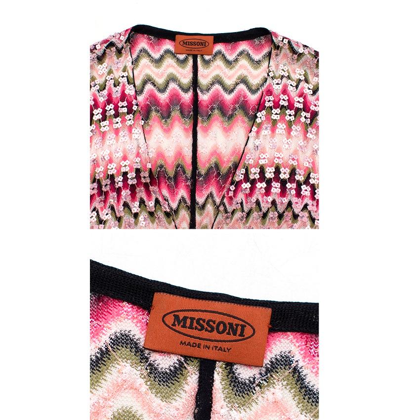 Missoni pink zig-zag pattern sequins top and cardigan set

Cardigan features:
-multicolour zigzag pattern
-sequins detail
-long style
-front tie fastening with fur tassel

Top features:
-scoop neckline
-sleeveless
-contrast trim
Made in Italy