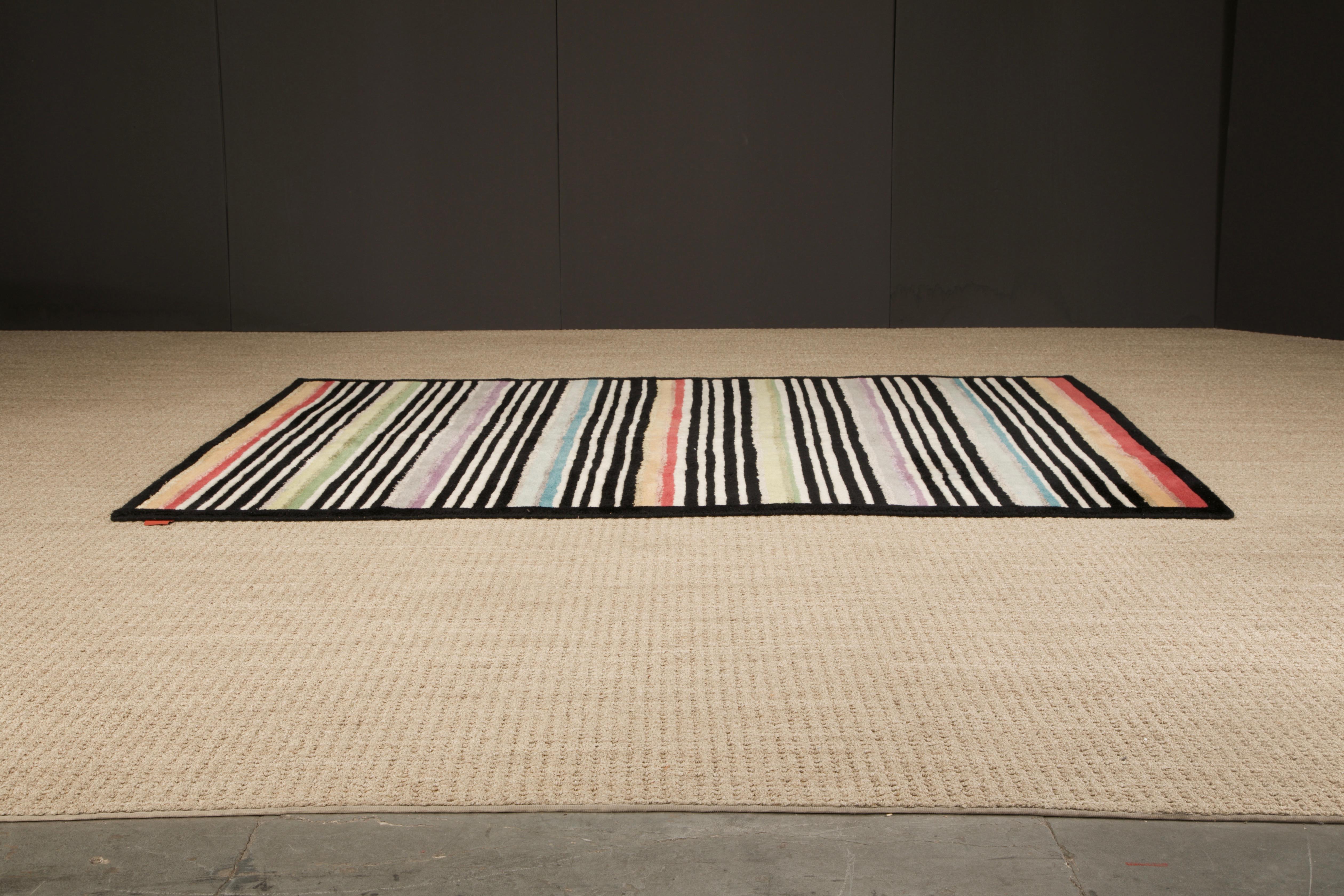 Attention interior designers, this is the large rug you need for that high-profile cover-worthy room you're working on. This signed Missoni rug is from the 1980s Italy and in an oh-so-on-trend Post-Modern design featuring classic Missoni colors in a