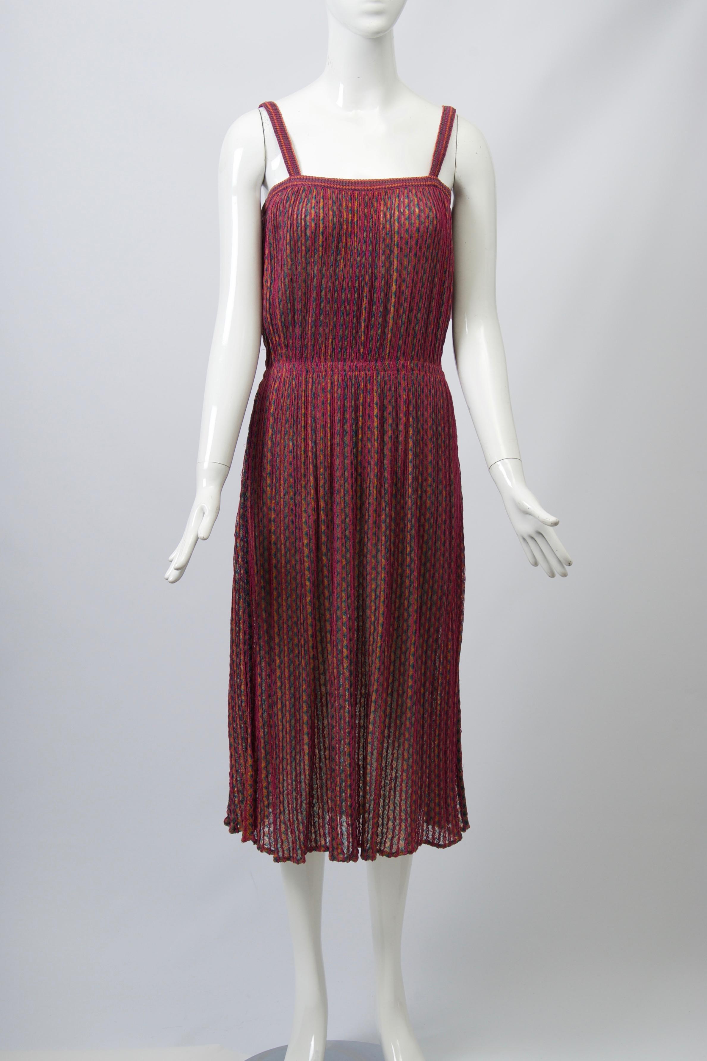 Missoni sundress, c.1970s-'80s, with spaghetti straps and interior elastic band that gathers the fabric in at the waist. Predominantly raspberry zigzag stripe knit. Light, packable and easy to wear. Unlabeled, except for size S (waist flexible).