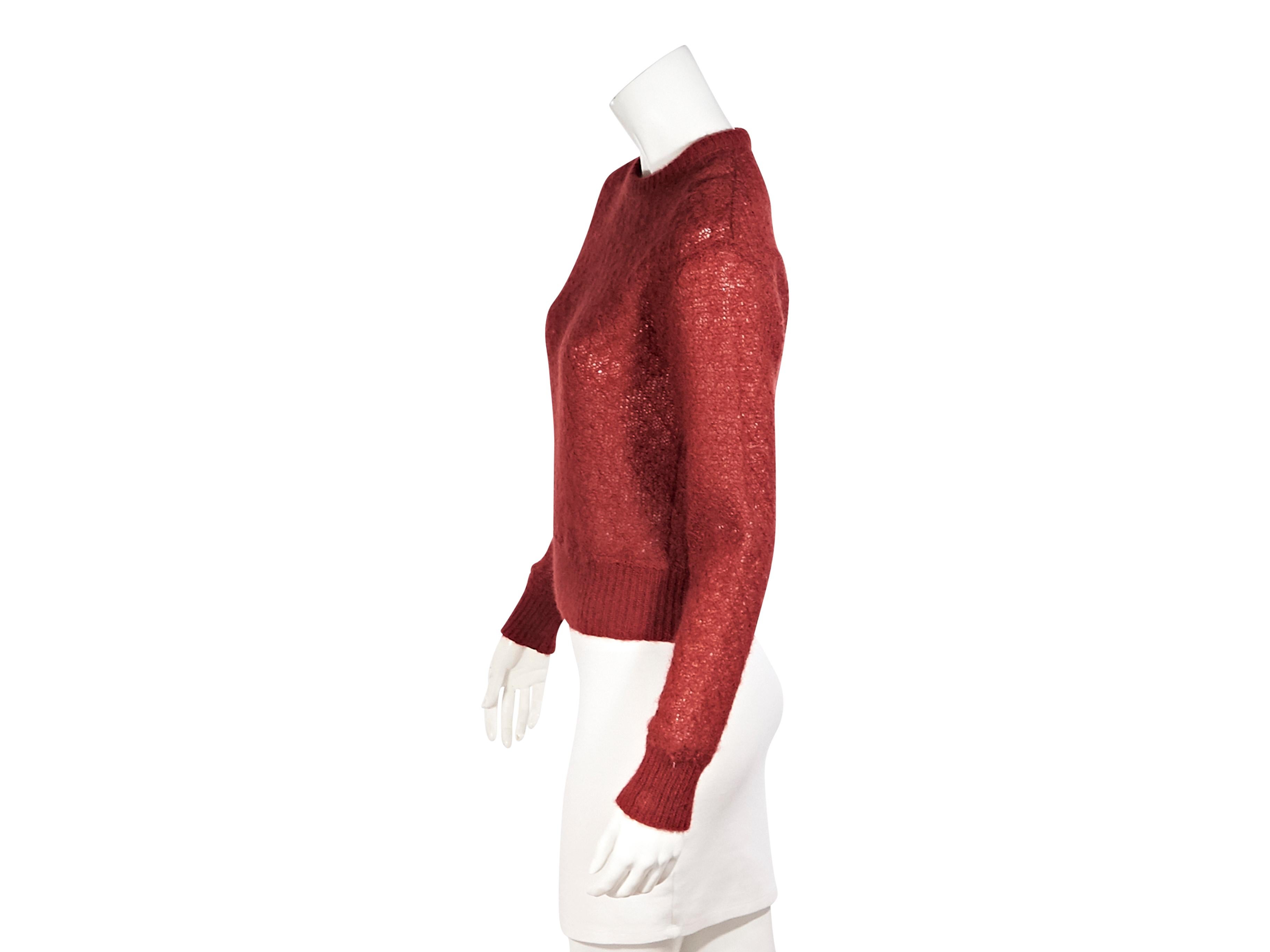 Product details:  Vintage red mohair and wool blend sweater by Missoni.  Circa the 1980s.  Crewneck.  Long sleeves.  Ribbed cuffs and hem.  Pullover style.  38