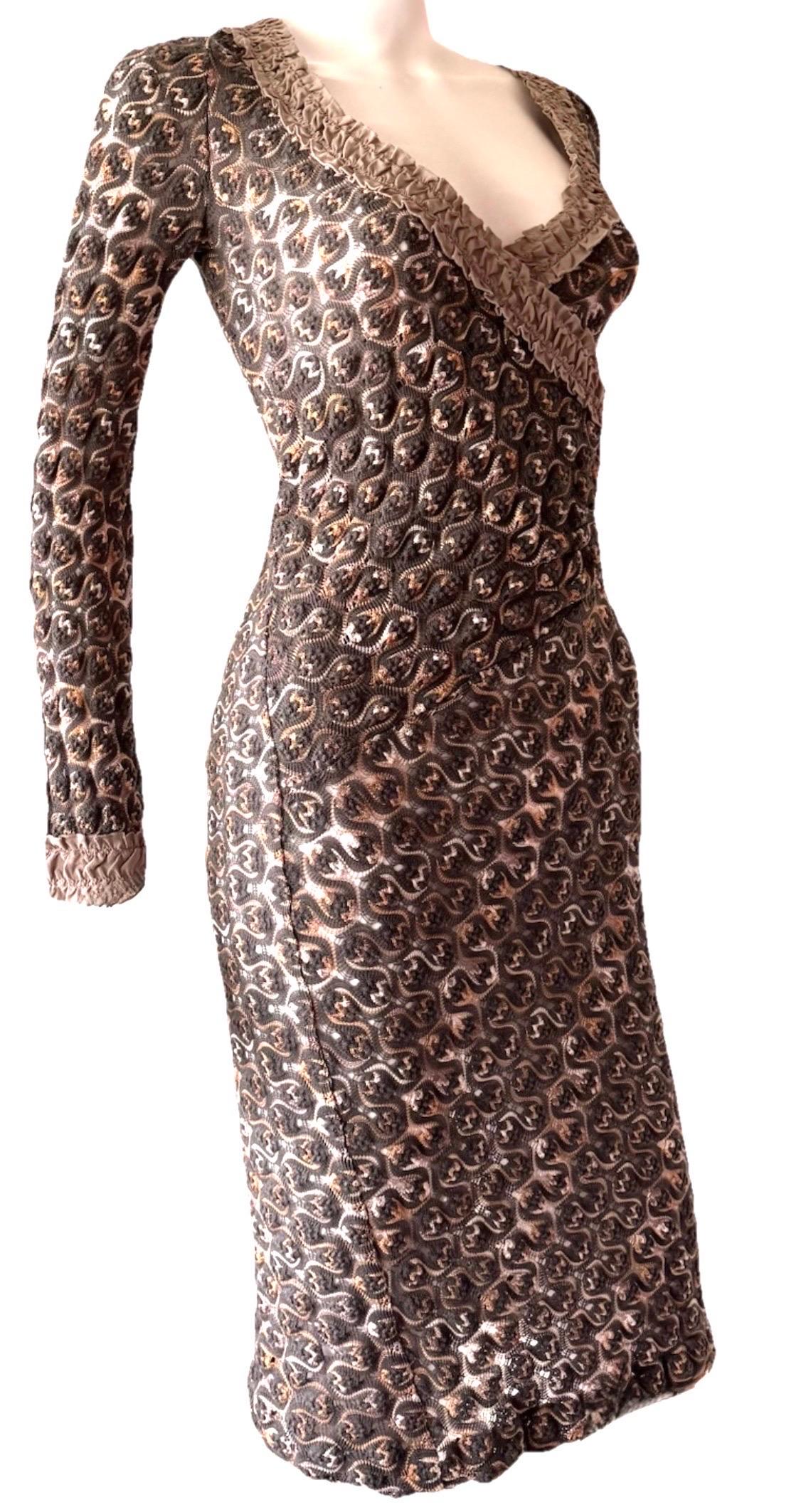 A signature piece from Missoni’s Fall 2007 runway, this V-neck wrap-effect dress showcases the house’s iconic knitwork in a modern neutral palette. Woven in an intricate open crochet pattern with rich earth tones, it molds gently to the body,