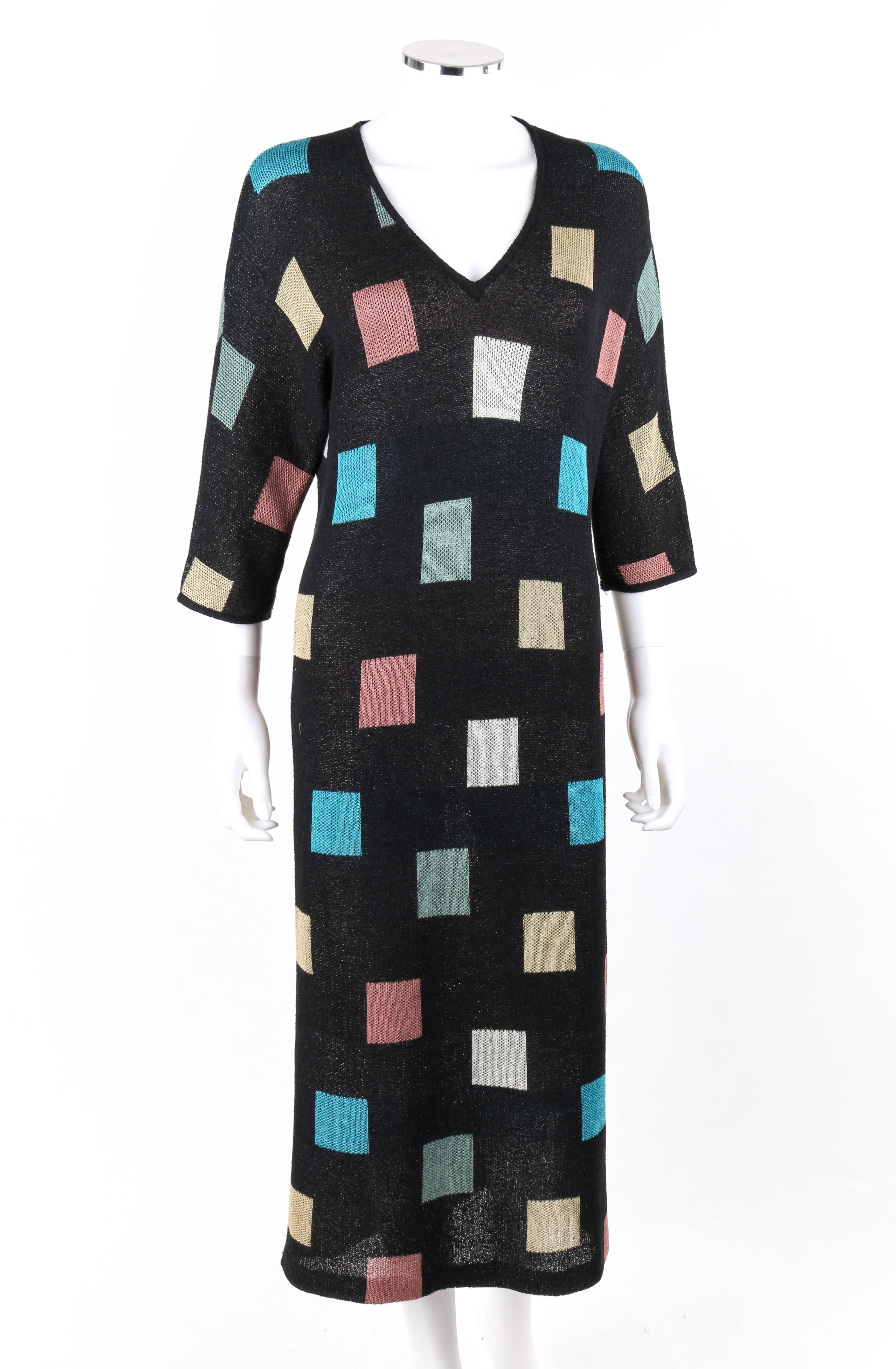 Vintage Missoni Spring / Summer 1984 black multi-color square pattern knit v-neck maxi dress. Designed by Ottavio and Rosita Missoni. Black double knit with square pattern in shades of white, pink, yellow, green, and blue. V-neckline. 3/4 length
