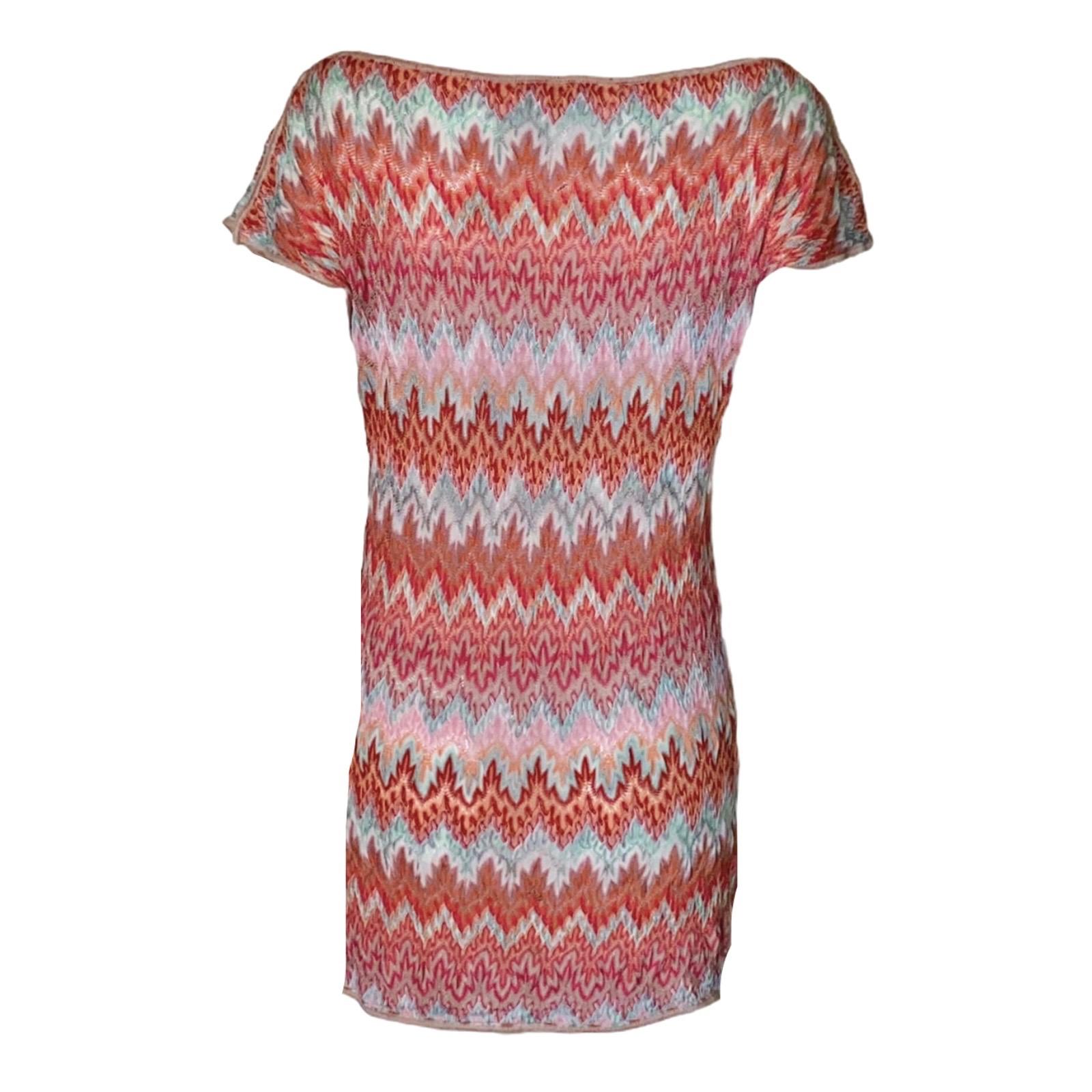 This stunning multicolored Missoni knitted mini dress epitomizes jet-set glamour. The signature geometric weave will update your look in a flash.

DETAILS:

Beautiful multicolor & pink shades
Missoni signature geometric weave
Boat neck
Vented cap