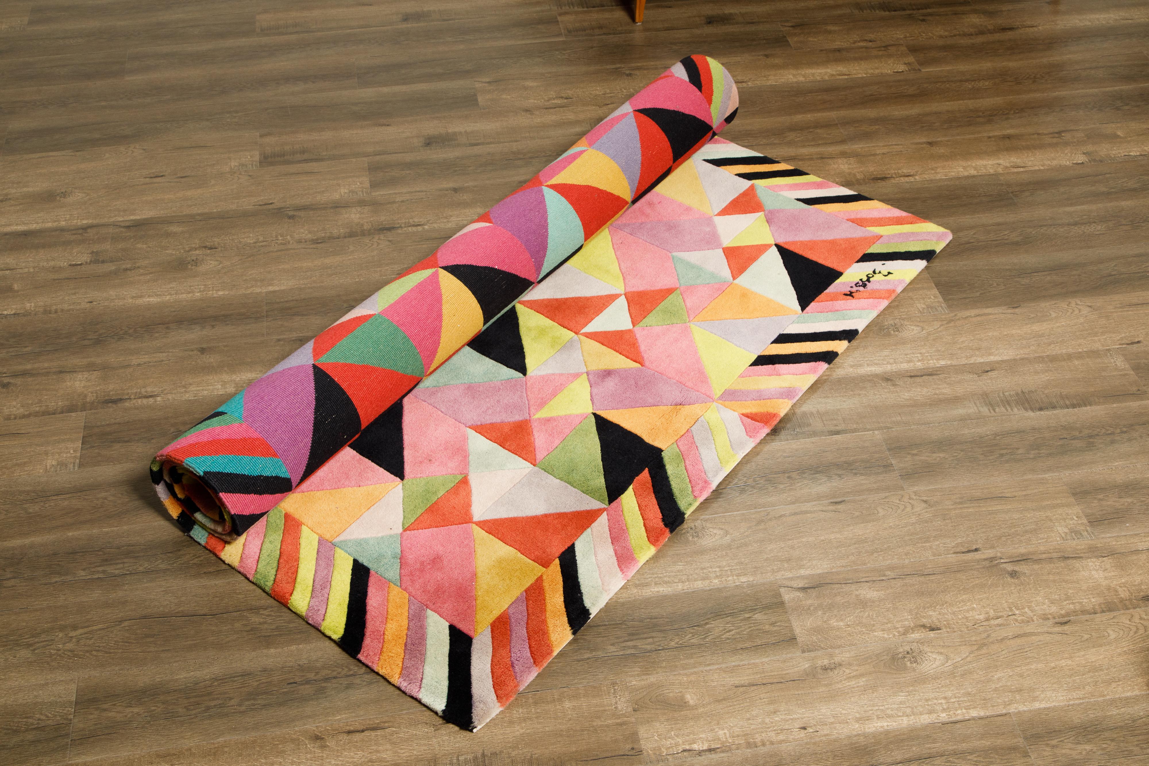 Attention interior designers, this is the large rug you need for that high-profile cover-worthy room you're working on. This signed Missoni rug is from the 1980s and in an oh-so-on-trend Post-Modern design featuring classic Missoni colors in a