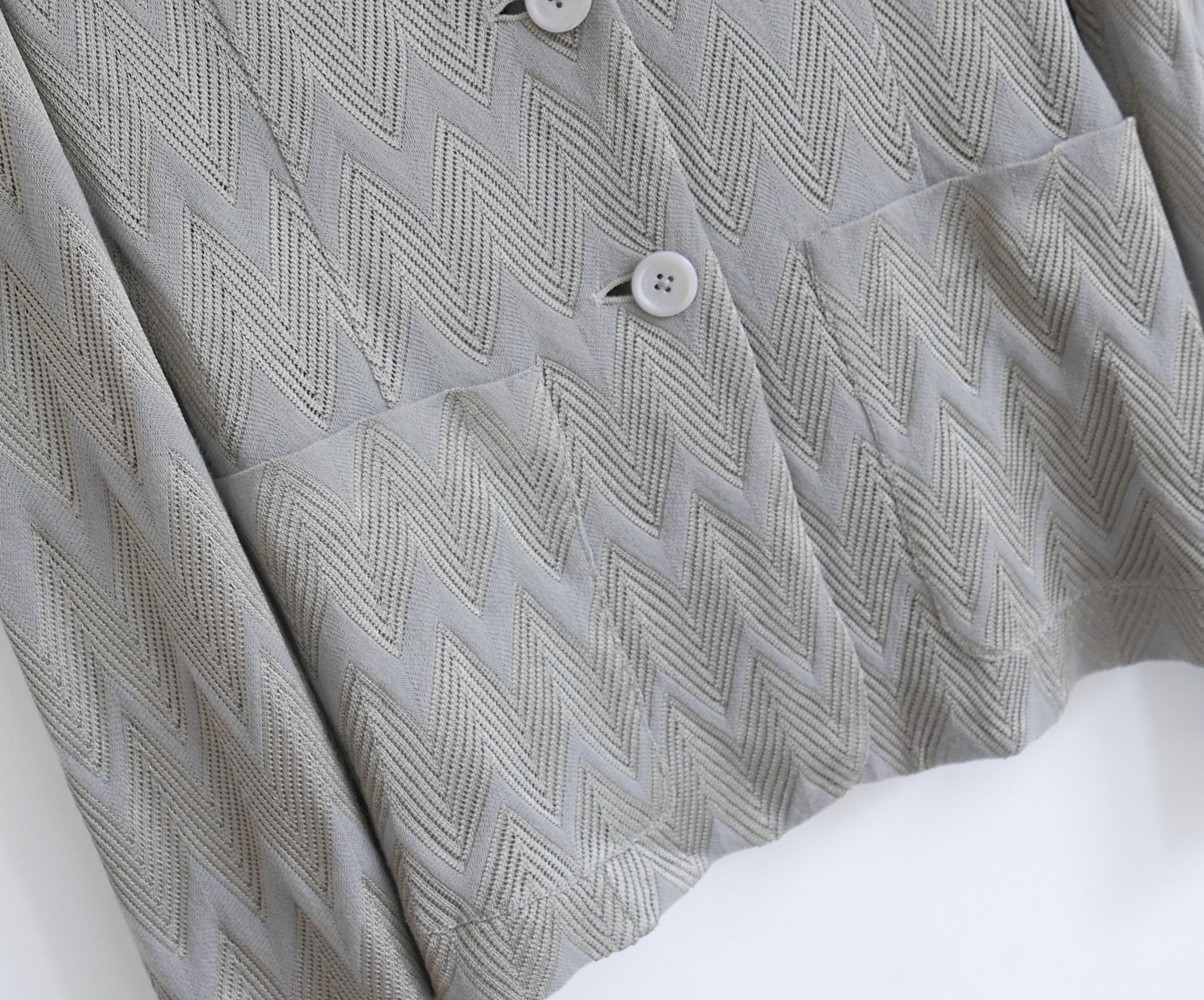 Classic, timeless Missoni knit blazer jacket. Bought for £1300 and new with tags. Made from silver grey and taupe grey rayon and wool with signature texture zig zag weave, it has a semi relaxed fit with patch pockets, small lapels and shaped back