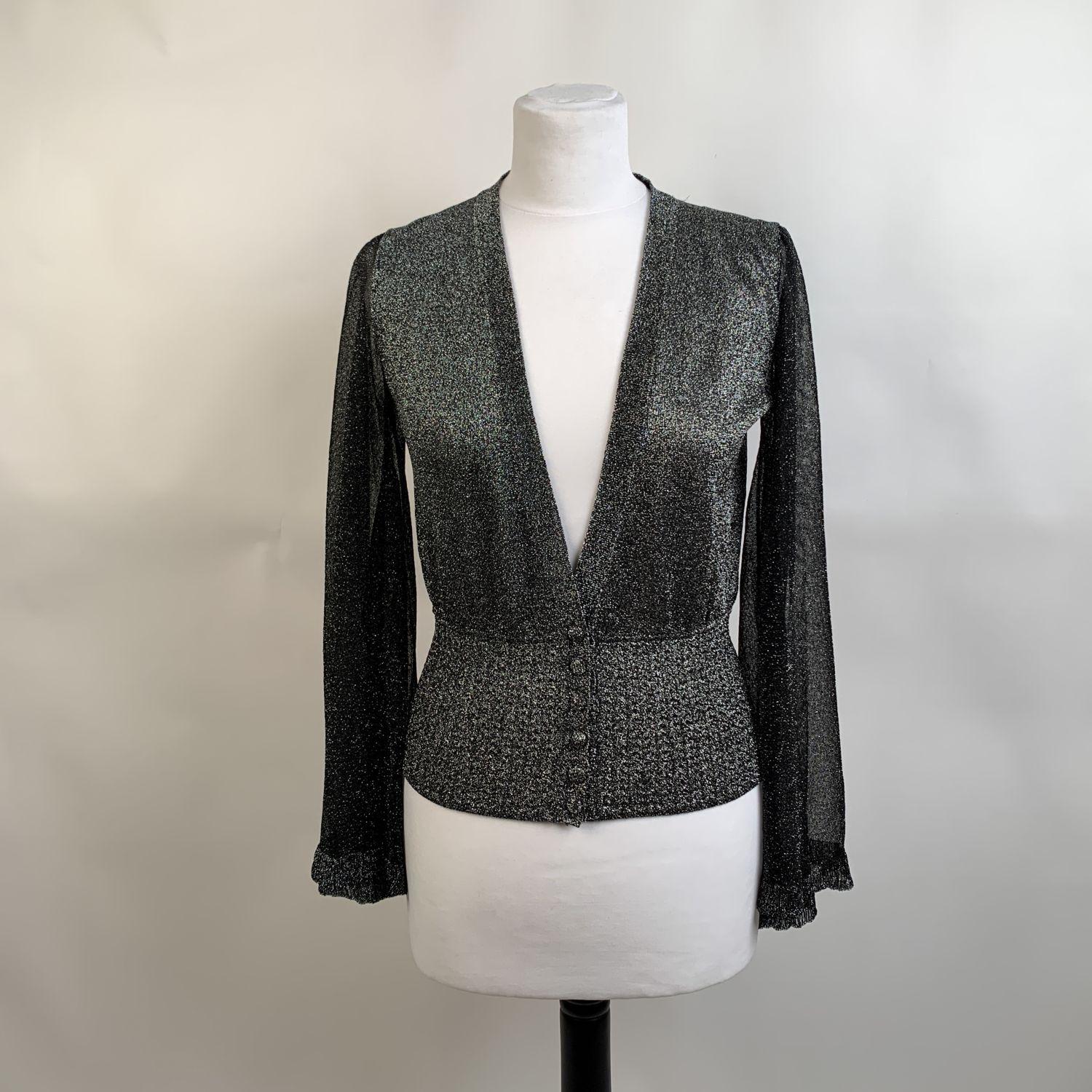 Missoni silver tone lurex cardigan with flared sleeves. It features button closure on the front and a deep V-neckline. Made in Italy. Size: 38 IT (The size shown for this item is the size indicated by the designer on the label). It should correspond