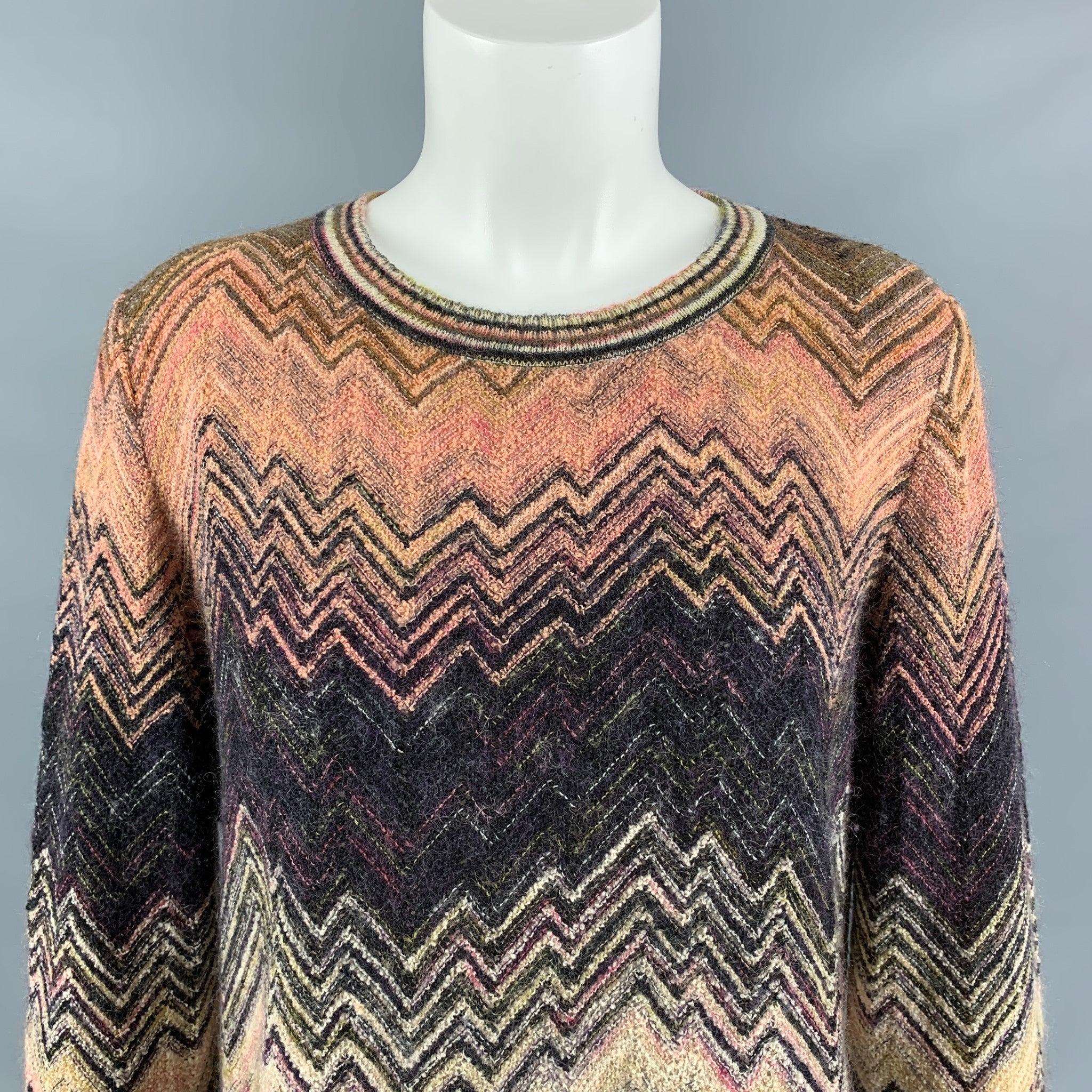 MISSONI sweater comes in a multi-color wool blend knitted featuring a zig zag pattern , round neckline, and fringe at bottom hem. Made in Italy. Excellent Pre-Owned Condition. Fabric tag removed. 

Marked:   46 

Measurements: 
 
Shoulder: 17