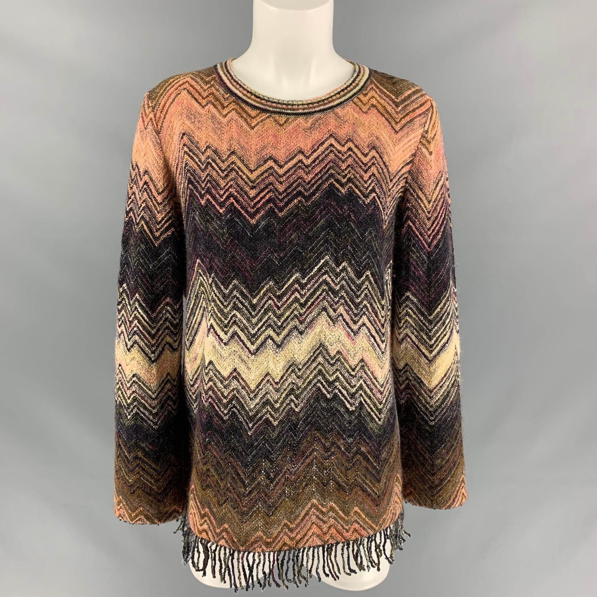 MISSONI sweater comes in a multi-color wool blend knitted featuring a zig zag pattern , round neckline, and fringe at bottom hem. Made in Italy.

Excellent Pre-Owned Condition. Fabric tag removed.
Marked: 46

Measurements:

Shoulder: 17 in
Bust: 46