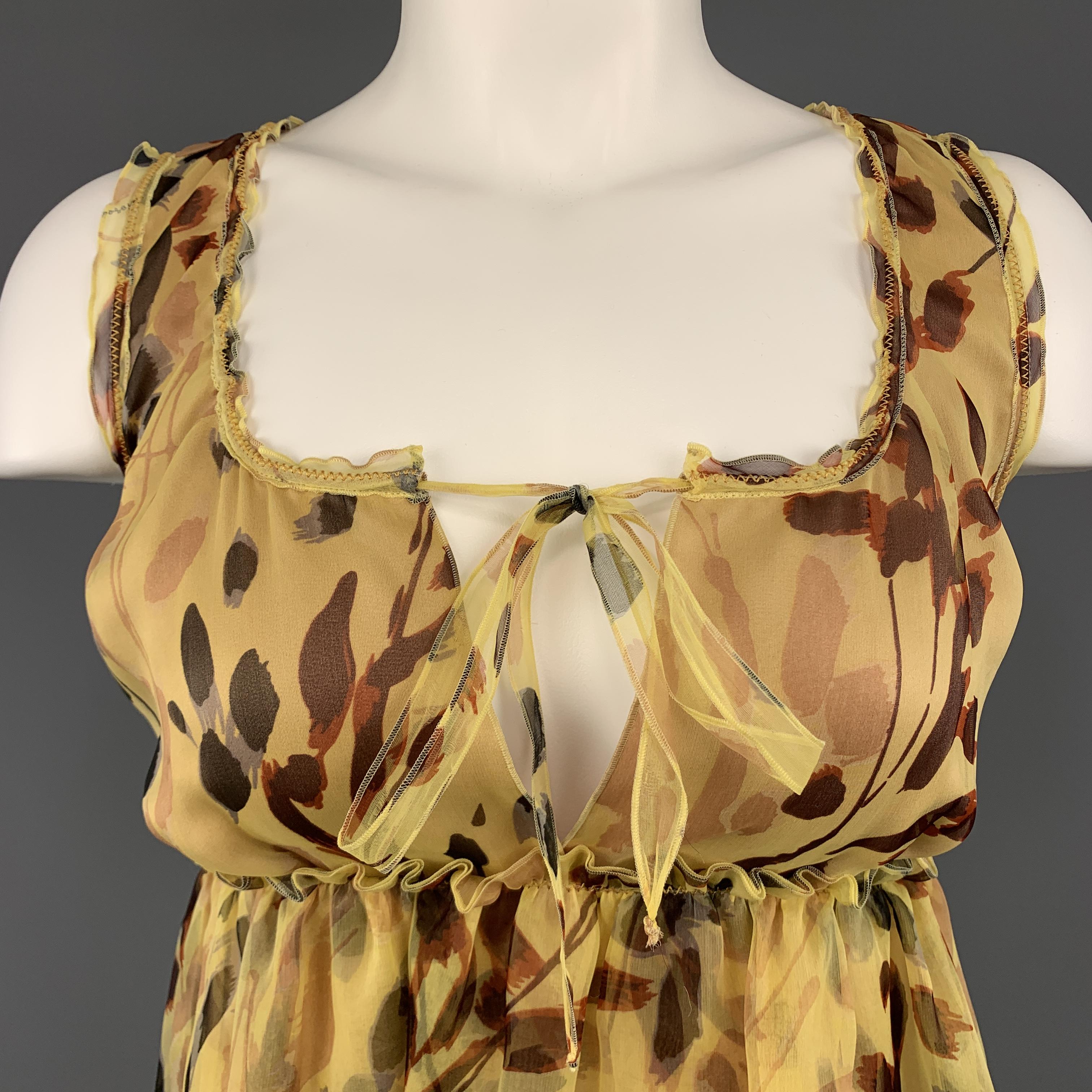 MISSONI camisole top comes in yellow leaves print silk with a tied scoop neck ands ruffled A line hem. Made in Italy.

Excellent Pre-Owned Condition.
Marked: IT 38

Measurements:

Shoulder: 12 in.
Bust: 32 in.
Length: 20.5 in.