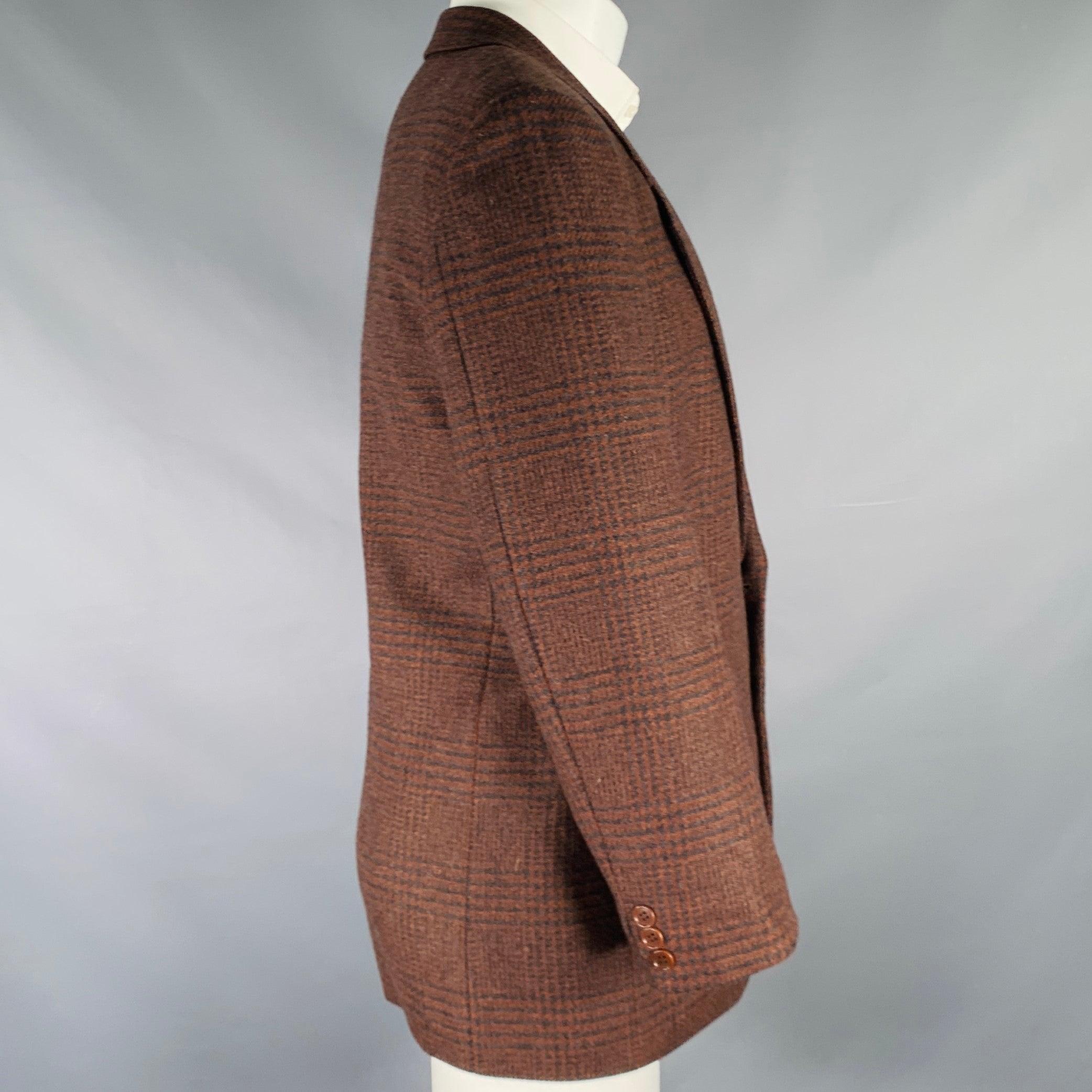 Vintage MISSONI UOMO oversized sport coat
in a brown and black virgin wool fabric featuring a glenplaid pattern, notch lapel, ventless back, and double button closure. Made in Italy.Excellent Pre-Owned Condition. 

Marked:   48R 

Measurements: 
