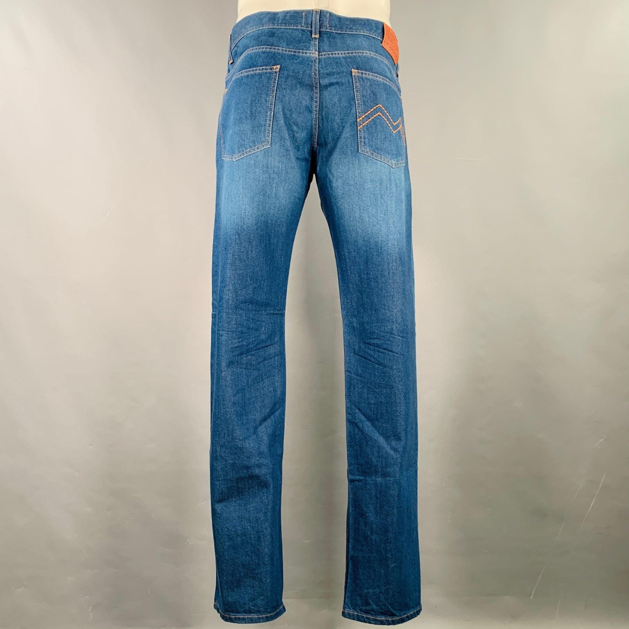 MISSONI jeans
in a blue cotton woven denim featuring yellow contrast stitching, straight leg, and button fly closure. Made in Italy.Excellent Pre-Owned Condition. 

Marked:   IT 52, fits 39 inches  

Measurements: 
  Waist: 39 inches Rise: 8 inches