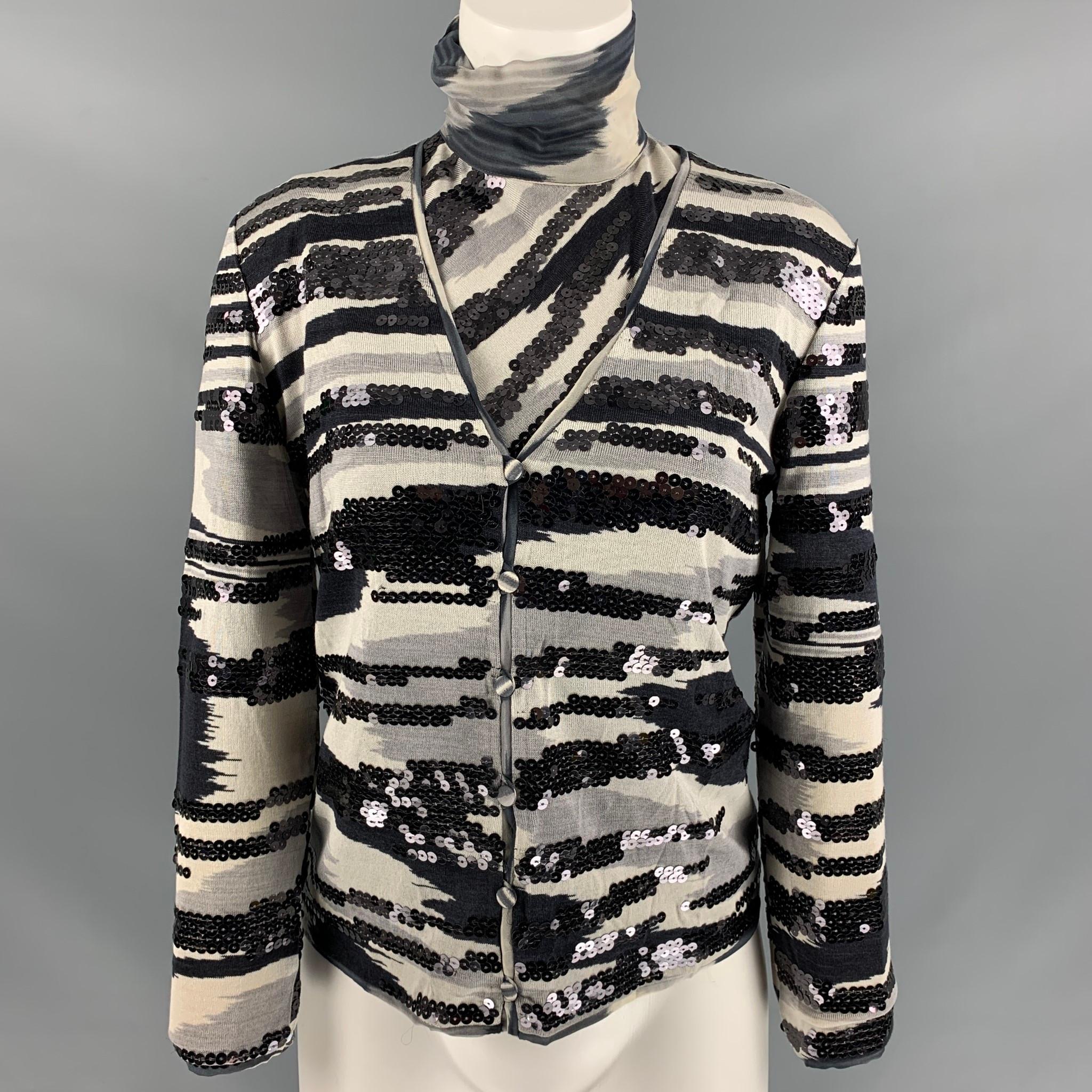 MISSONI dress top set comes in a black and grey silk featuring a sequins embroidery, turtleneck, button down. Made in Italy.

Excellent Pre-Owned Condition.
Marked: 42

Measurements:

Shoulder: 16 in
Bust: 38 in
Sleeve: 21 in
Length: 22 in

 

SKU: