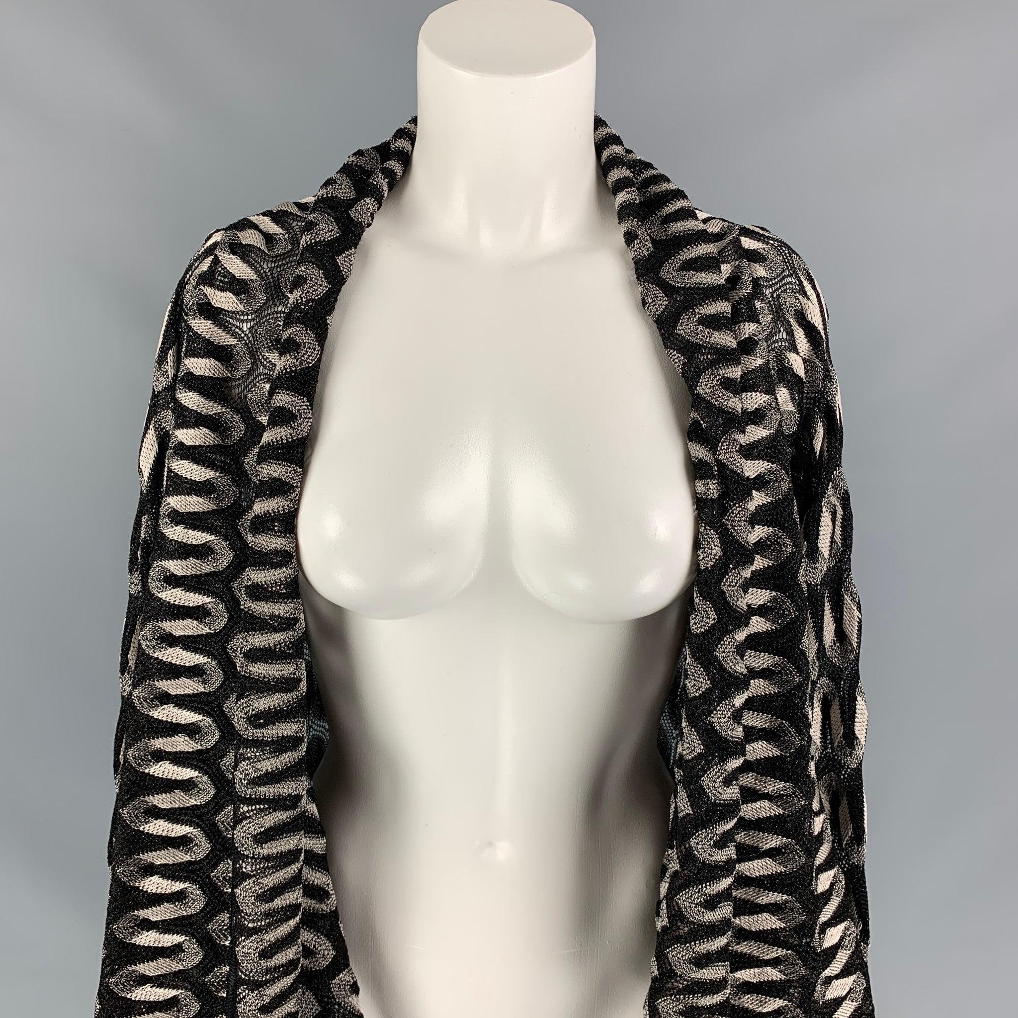MISSONI coat comes in a black & silver metallic knitted viscose blend featuring long sleeve and a open front.
Very Good
Pre-Owned Condition. 

Marked:  42 

Measurements: 
 
Shoulder: 15 inches Bust: 38 inches Sleeve: 31 inches Length: 39 inches 
 
