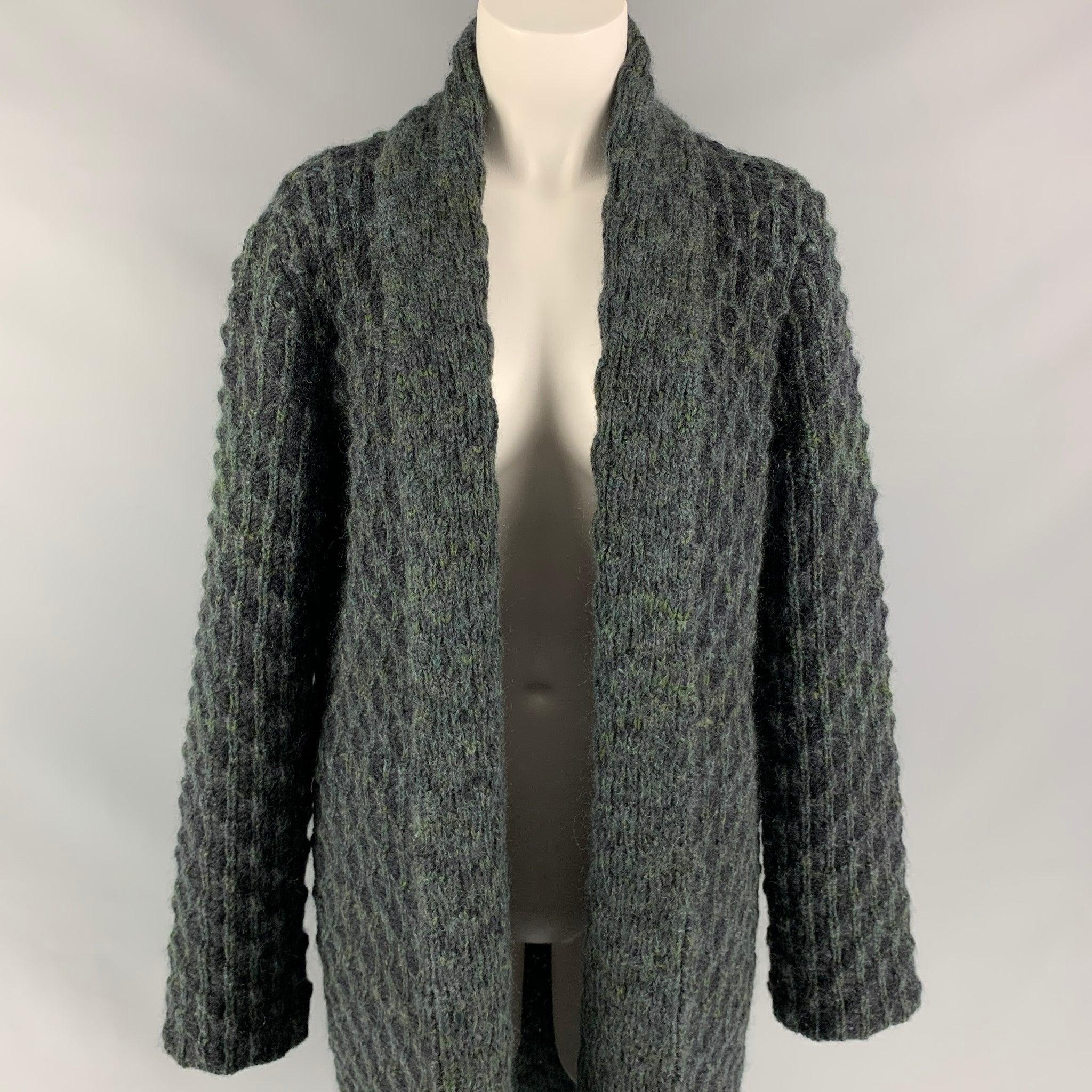 MISSONI coat comes in a charcoal & green knitted wool / mohair featuring a shawl collar, slit pockets, and a open front.
Very Good
Pre-Owned Condition. 

Marked:  42 

Measurements: 
 
Shoulder: 17.5 inches Bust: 40 inches Sleeve: 27 inches Length: