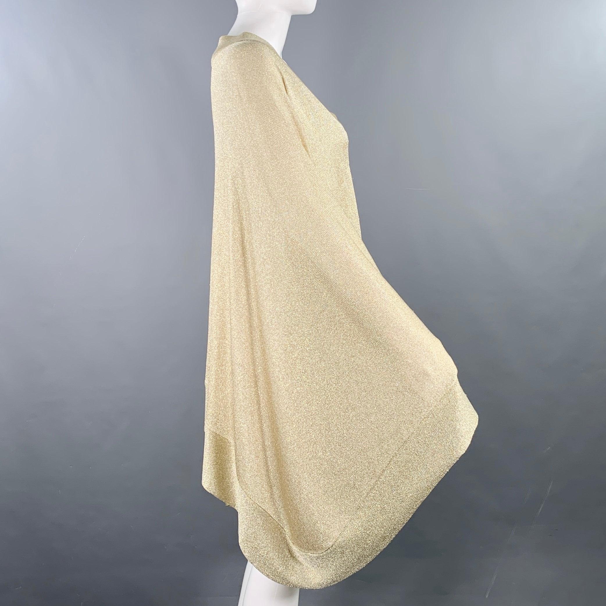 MISSONI sweater in a gold metallic viscose blend featuring a poncho style and v-neck. Made in Italy.
Very Good Pre-Owned Condition. Minor snags. 

Marked:   IT 42 

Measurements: 
 
Shoulder: 17 inches  Sleeve: 29.5 inches  Length: 27 inches 

  
 