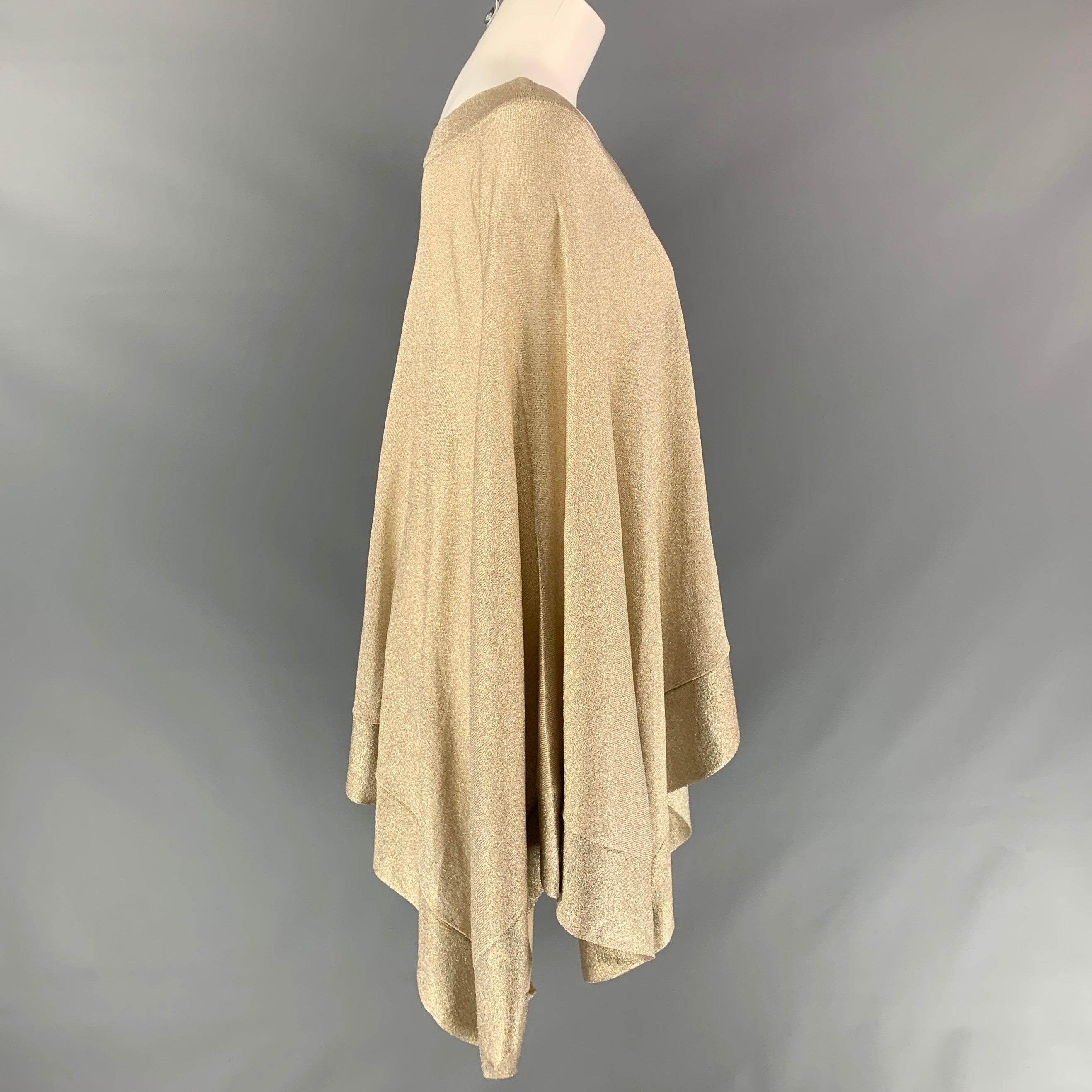 MISSONI sweater comes in a gold metallic viscose blend featuring a poncho style and 
 v-neck. Made in Italy.
 Very Good Pre-Owned Condition. 
 

 Marked:  42 
 

 Measurements: 
  
 Shoulder: 17 inches Sleeve: 29.5 inches Length: 27 inches 
  
  
 