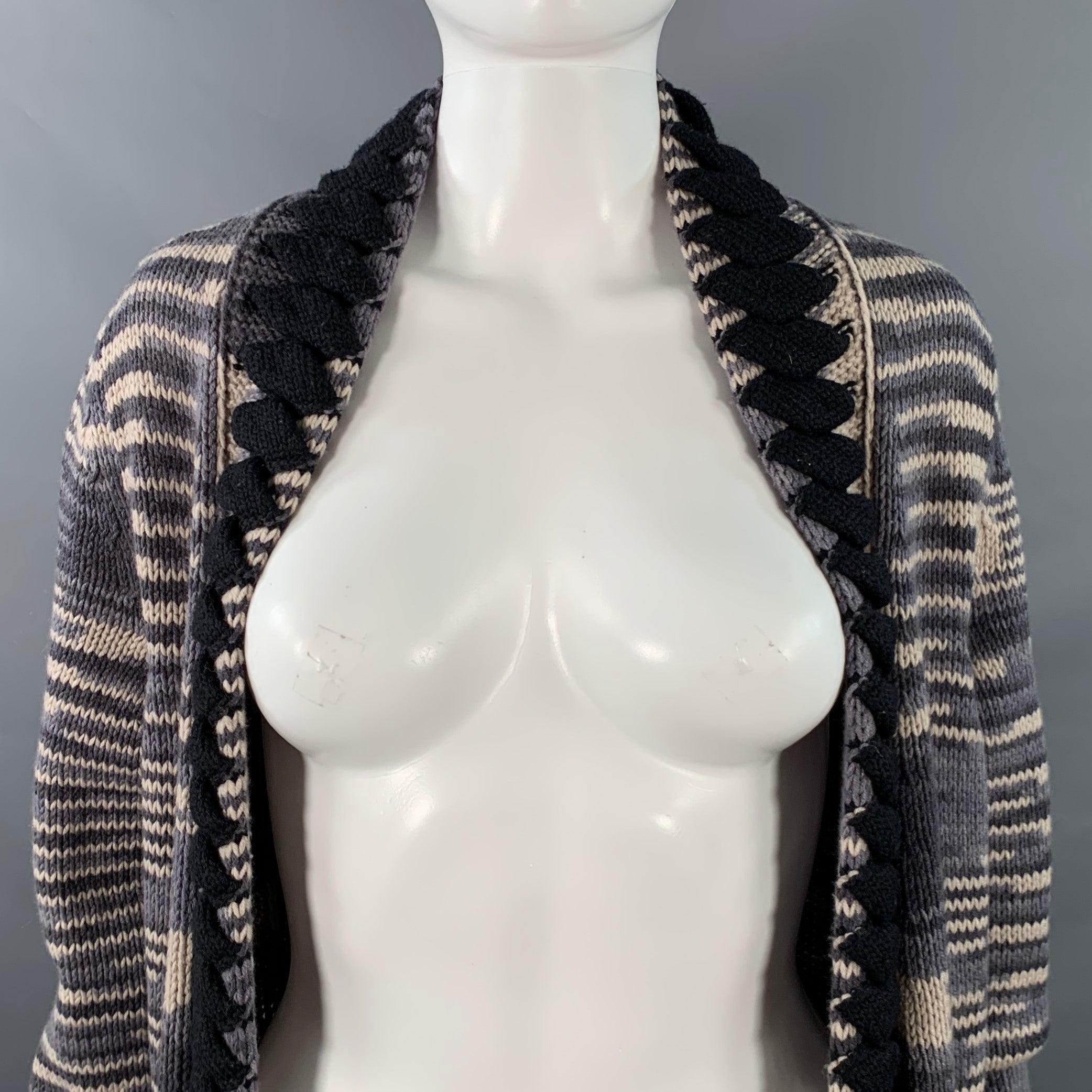 MISSONI cardigan
in a grey, black, and white cashmere wool blend knit featuring an all over stripe pattern, textured black lapel trim, two pockets, and open front.
Made in Italy.Excellent Pre-Owned Condition. 

Marked:   IT 42 

Measurements: 
