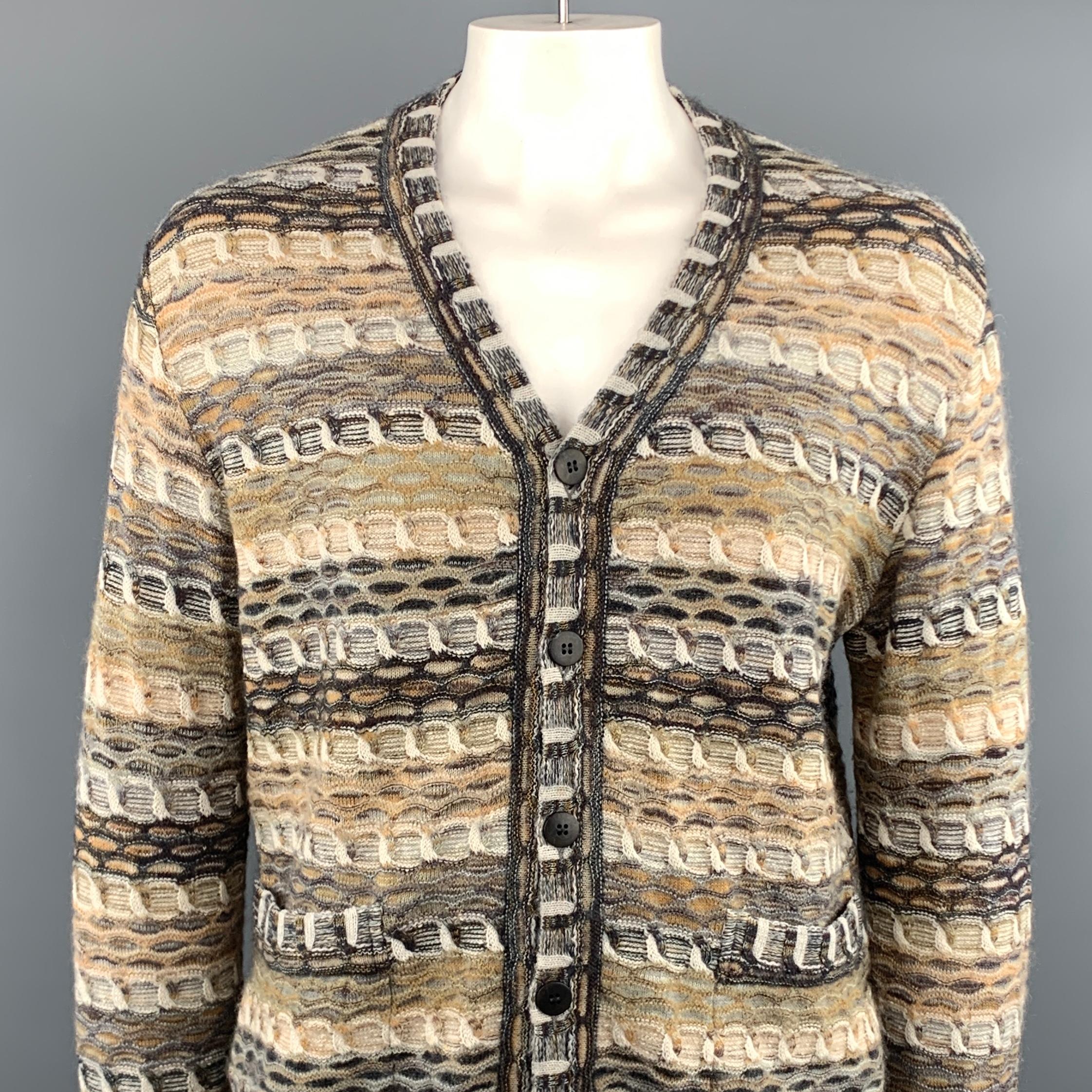 MISSONI cardigan comes in a beige melange wool blend featuring a buttoned closure and patch pockets. Made in Italy.
 
Excellent Pre-Owned Condition.
Marked: 50
 
Measurements:
 
Shoulder: 21 in.
Chest: 46 in.
Sleeve: 29 in.
Length: 27.5 in