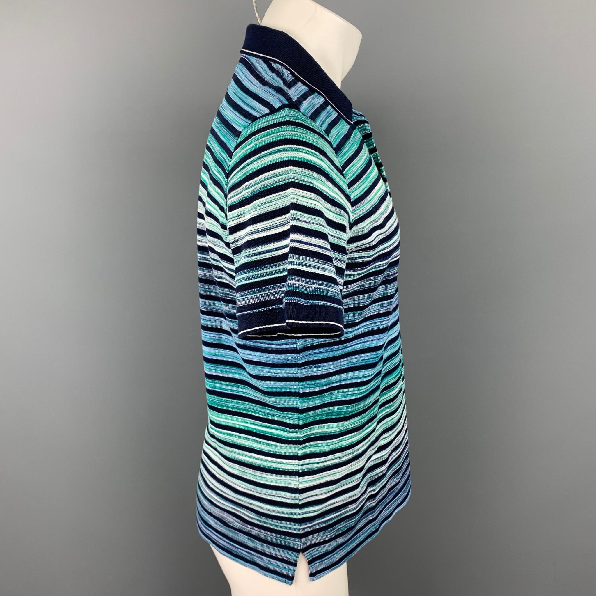 MISSONI polo comes in a black & blue stripe cotton featuring a spread collar and a buttoned closure. Made in Italy.

Very Good Pre-Owned Condition.
Marked: M
Original Retail Price: $426.00

Measurements:

Shoulder: 18 in.
Chest: 41 in.
Sleeve: 10