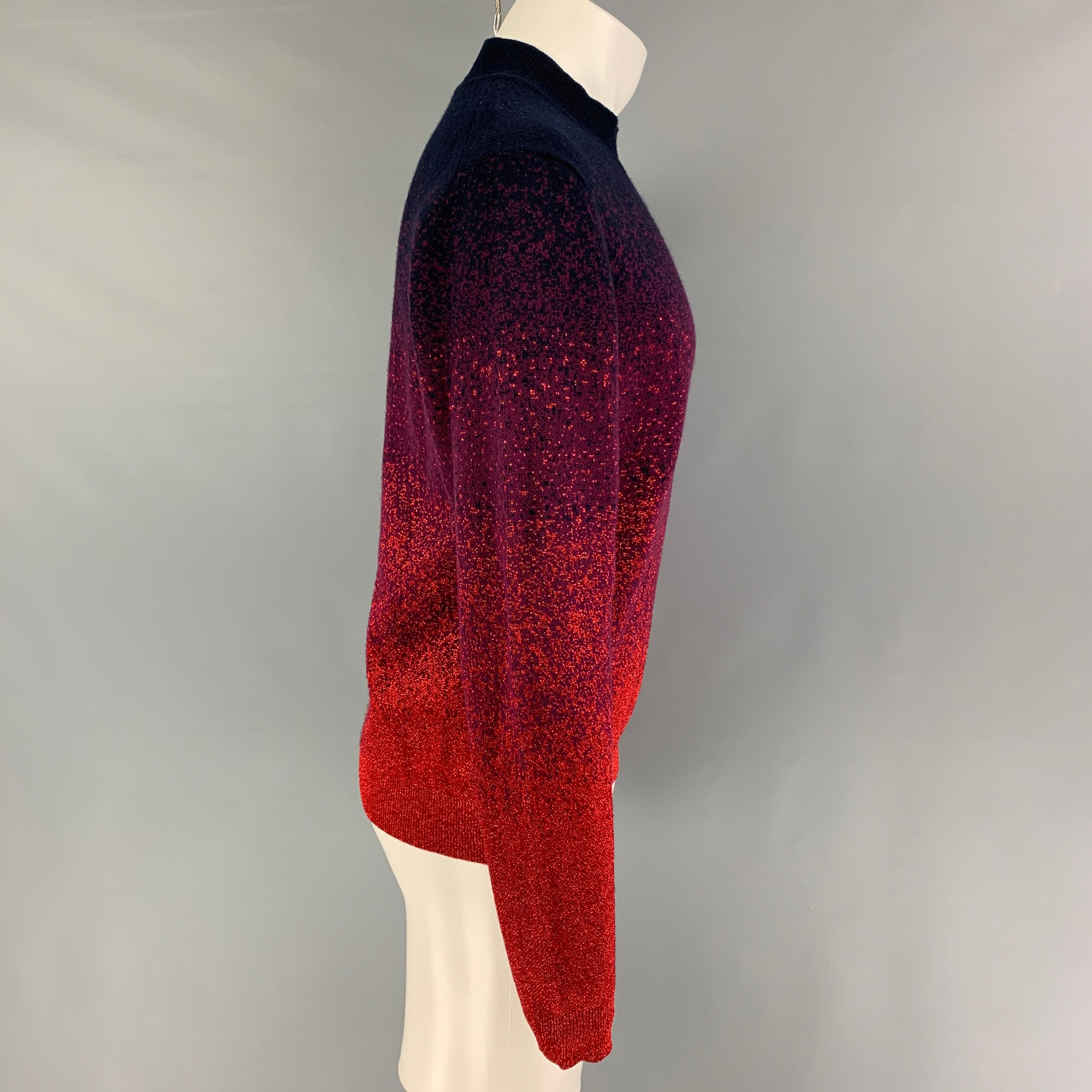 MISSONI pullover comes in a navy & red ombre metallic wool blend featuring a mock neck. Made in Italy.

Very Good Pre-Owned Condition.
Marked: 50

Measurements:

Shoulder: 21 in.
Chest: 42 in.
Sleeve: 27 in.
Length: 25.5 in. 