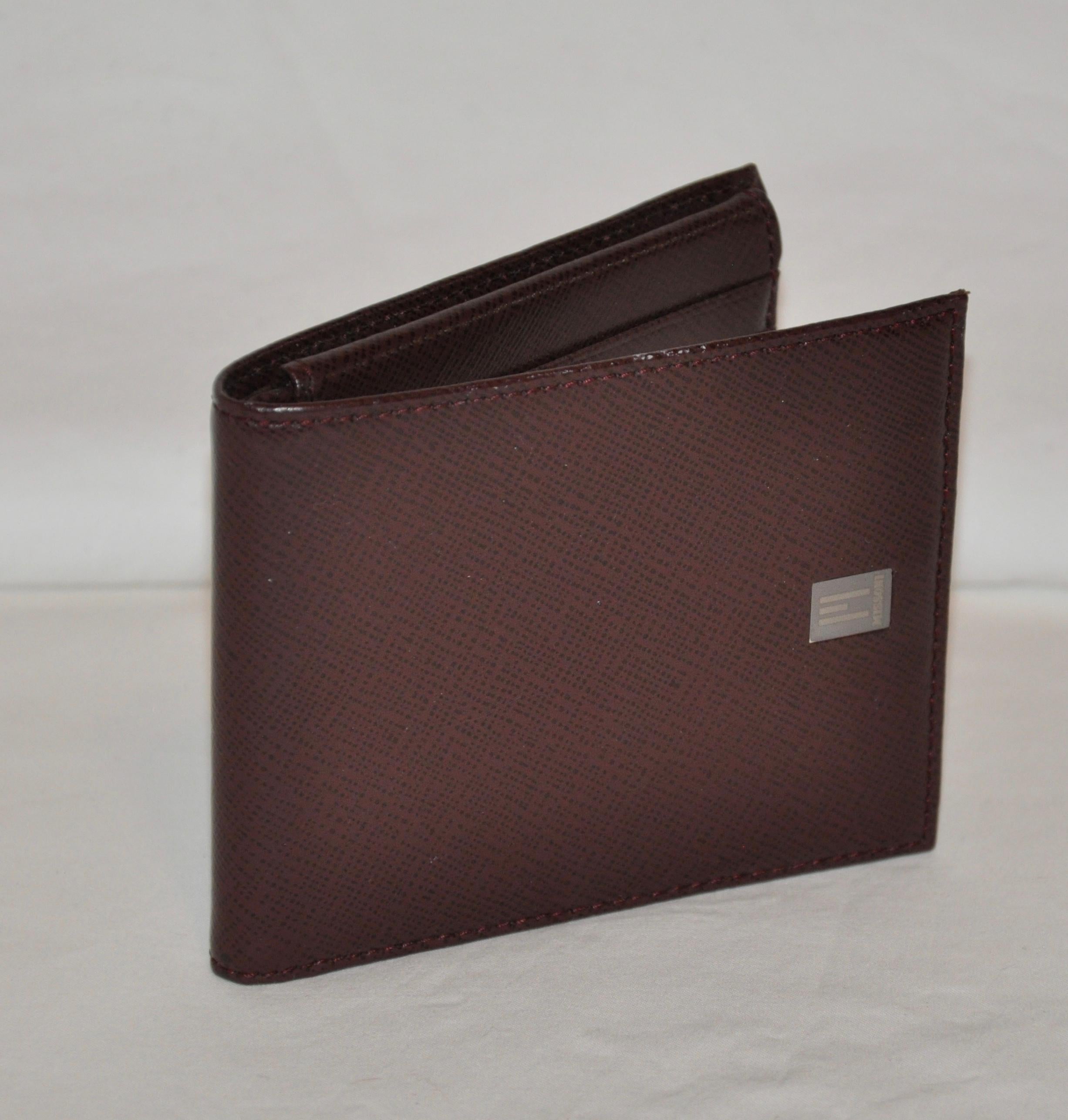 Missoni textured calfskin in brick-brown men's wallet has slots for 12 credit cards as well as a clear slot for, perhaps, a photo identification. When closed, the wallet measures 4 3/8 inches in length and 3 5/8 inches in height. Missoni's signature