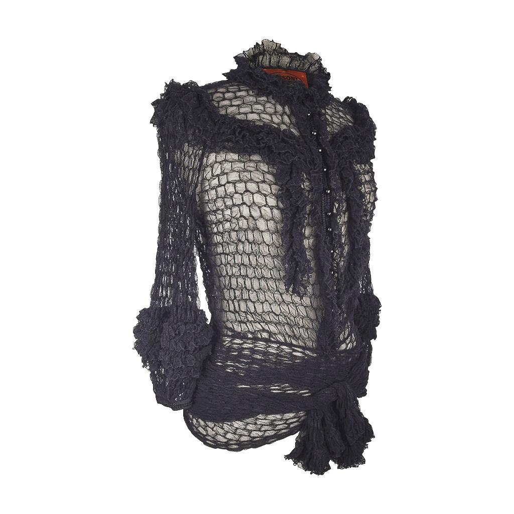 Guaranteed authentic unique Missoni gorgeous black mesh knit button down top.  
Round neck with small ruffles. 
3/4 sleeve with a puff at the cuff and ruffles.
Ruffle details around the top with a small tie.
The bottom has a long sash that can be
