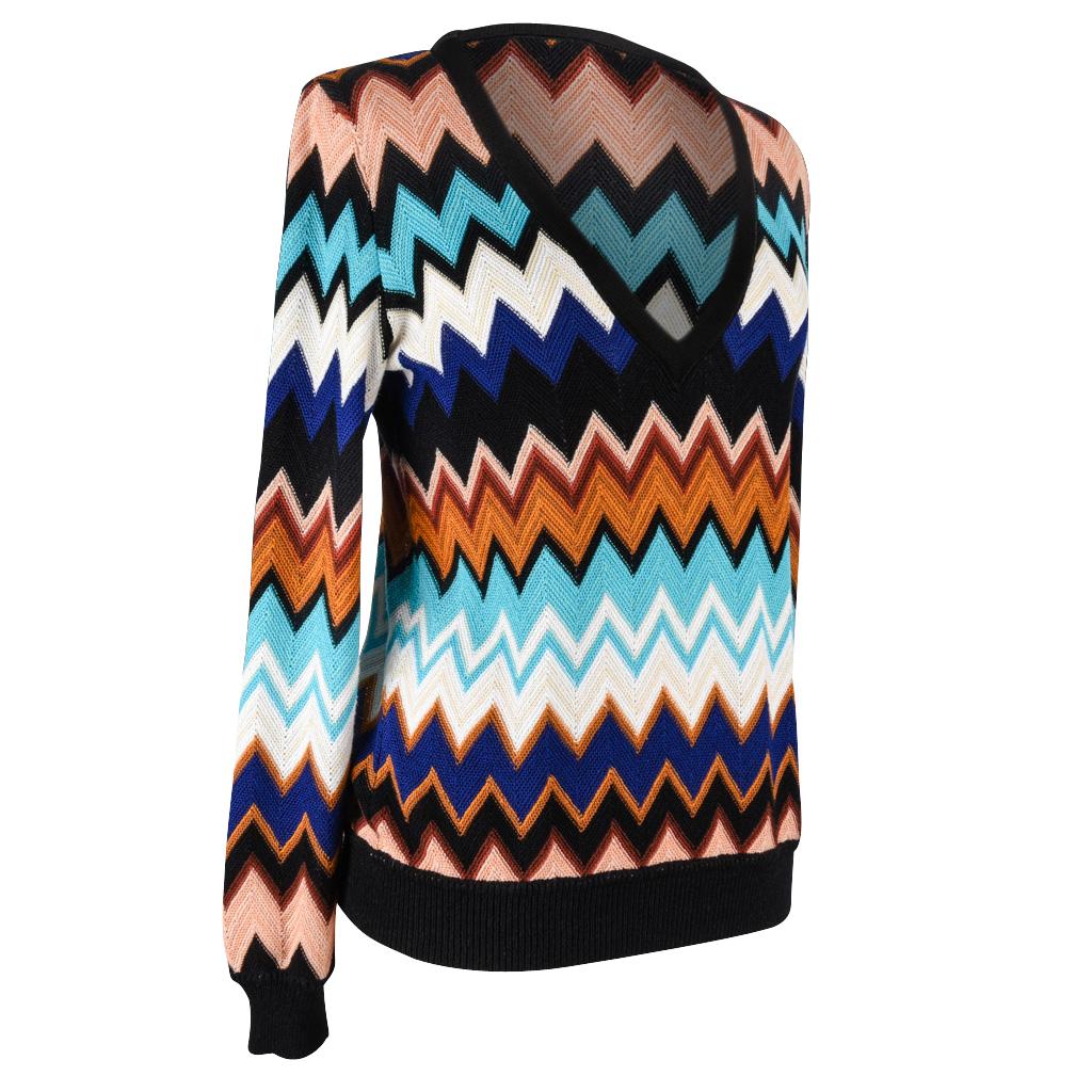 Guaranteed authentic Missoni V neck iconic print top.  
Zigzag print in black, pink, brown, blue, white and turquoise.  
Ribbing in black around collar, hip and neck.
Fabric is cotton, rayon and linen. 
final sale

SIZE  46
USA 10 

TOP