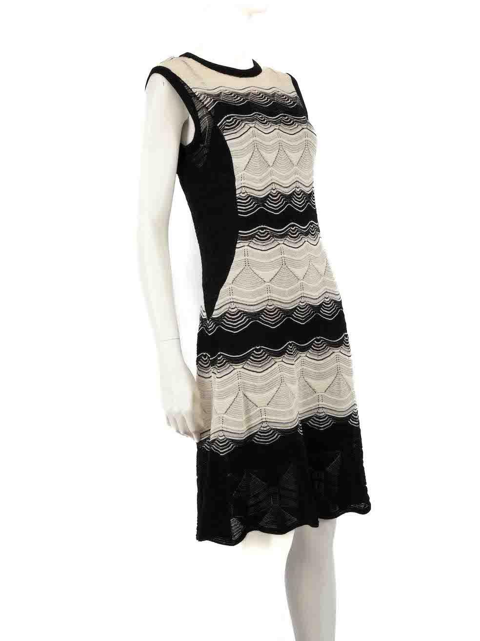 CONDITION is Very good. Hardly any visible wear to dress is evident on this used M by Missoni designer resale item. Come with sewn in slip.
 
 
 
 Details
 
 
 Two tone- black, white
 
 Synthetic
 
 Knit dress
 
 Sleeveless
 
 Midi
 
 Striped