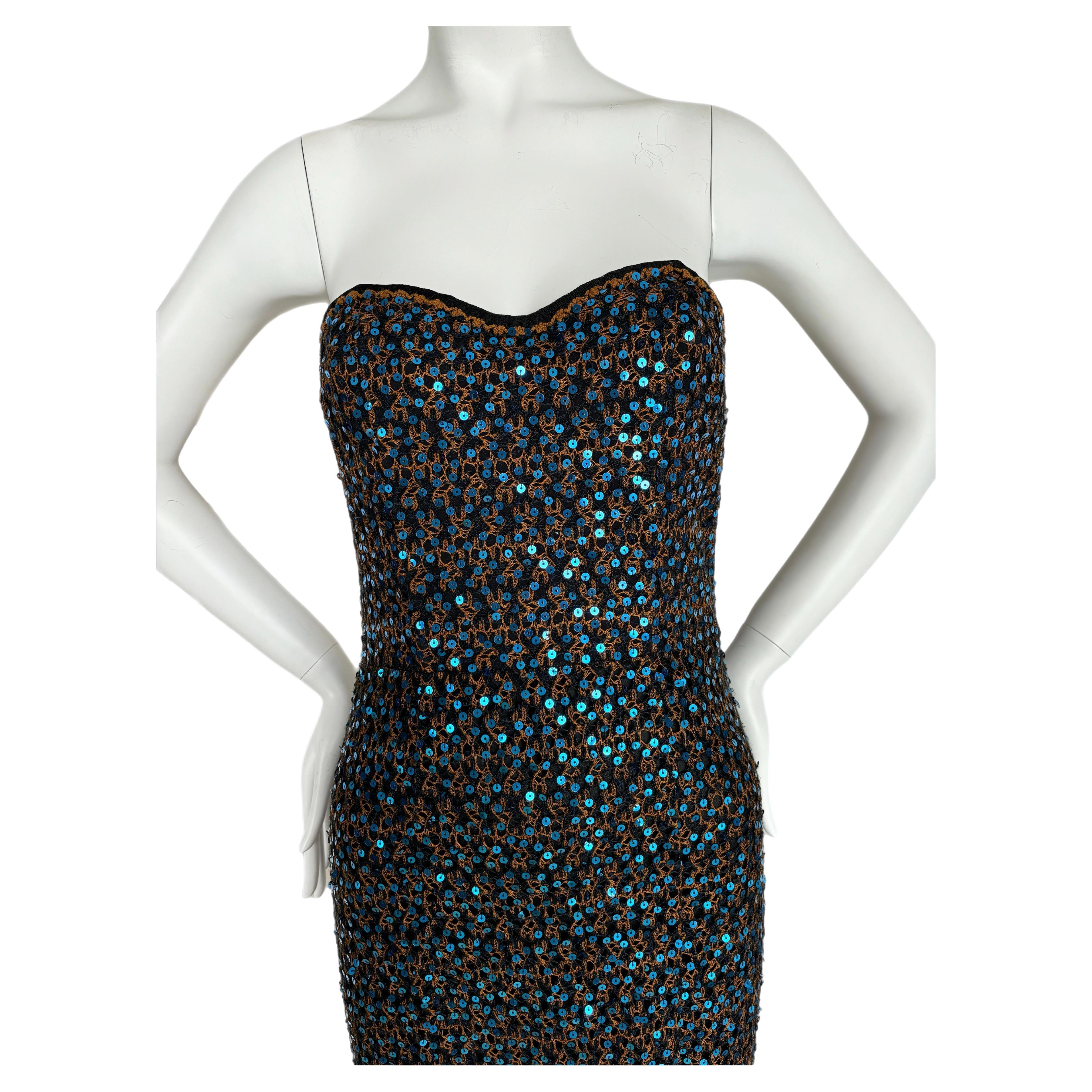 Missoni
Vintage
Bustier inside
IT42, but fits like an IT38
Blue and Orange
Semi-sheer bottom
Excellent vtg condition, minor feeling of wear

Measurements in inches laying flat: length 53, 13 to 14, waist 13 to 14 

The bust area is very tiny. It