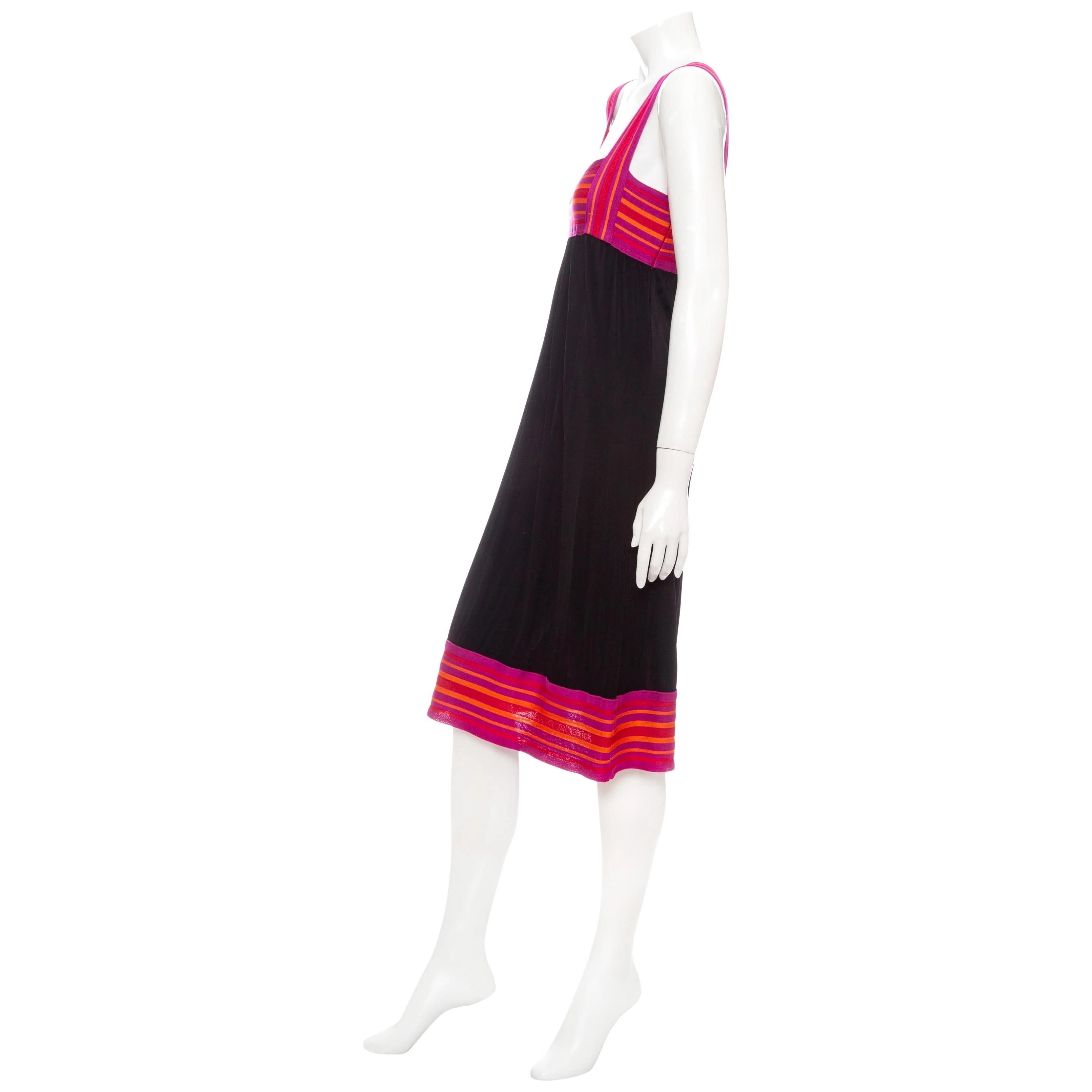 Missoni 1990s Black Viscose and Pink Knit Sleeveless Midi Dress

Vintage; circa early 1990s
M Missoni line
Black/Pink/Orange/Fuschia
Striped knit bust, straps, and hem
Sleeveless
Wide banded straps
Square neckline
Empire bust
Gathered at waist
Size