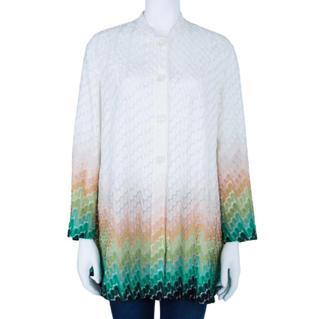 This stylish apparel from Missoni is sure to fetch you lots of compliments. Made from a perfect blend of rayon and polyester, this white cardigan showcases a wave knit pattern with colored highlights at the bottom. It features a button down closure,