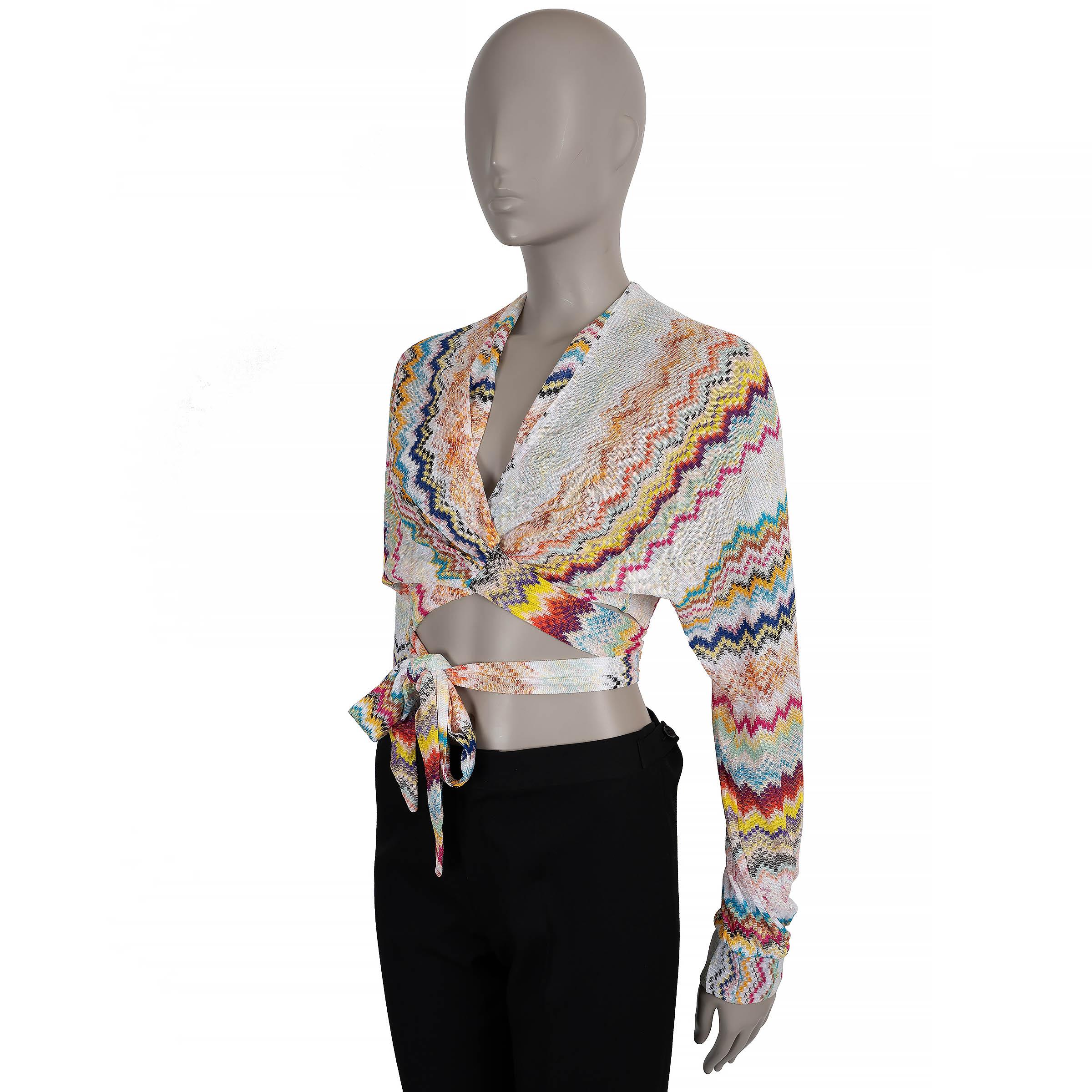 This 100% authentic Missoni Mare wrap top is crafted in white knit viscose (please note the content tag is missing), showcasing the brand’s signature multicolor zigzag pattern. Designed with a relaxed, cropped silhouette, it features a V-neckline,