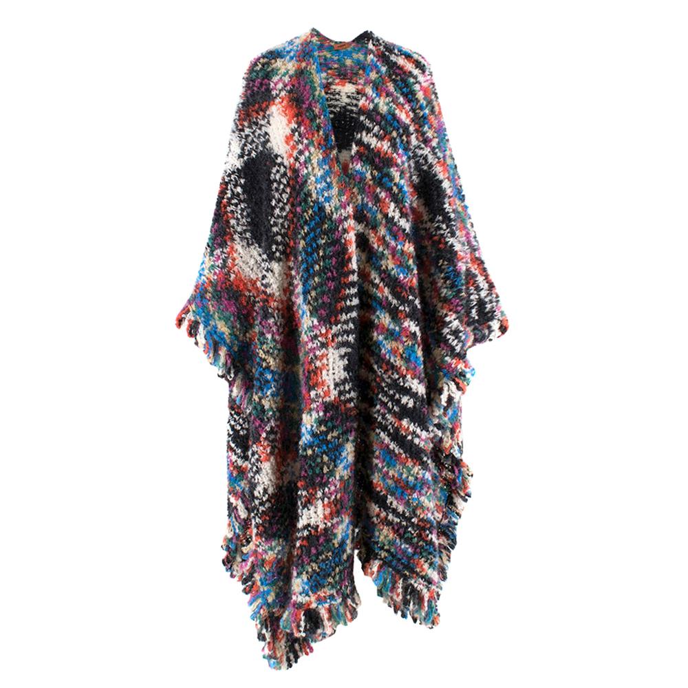 Missoni Wool Blend Multi Coloured Poncho 

Wool Blend
Multi-coloured 
V-shaped design
Tassel trim

Shoulder - 50cm
Chest - 58cm
Arms - 87cm
length - 112cm