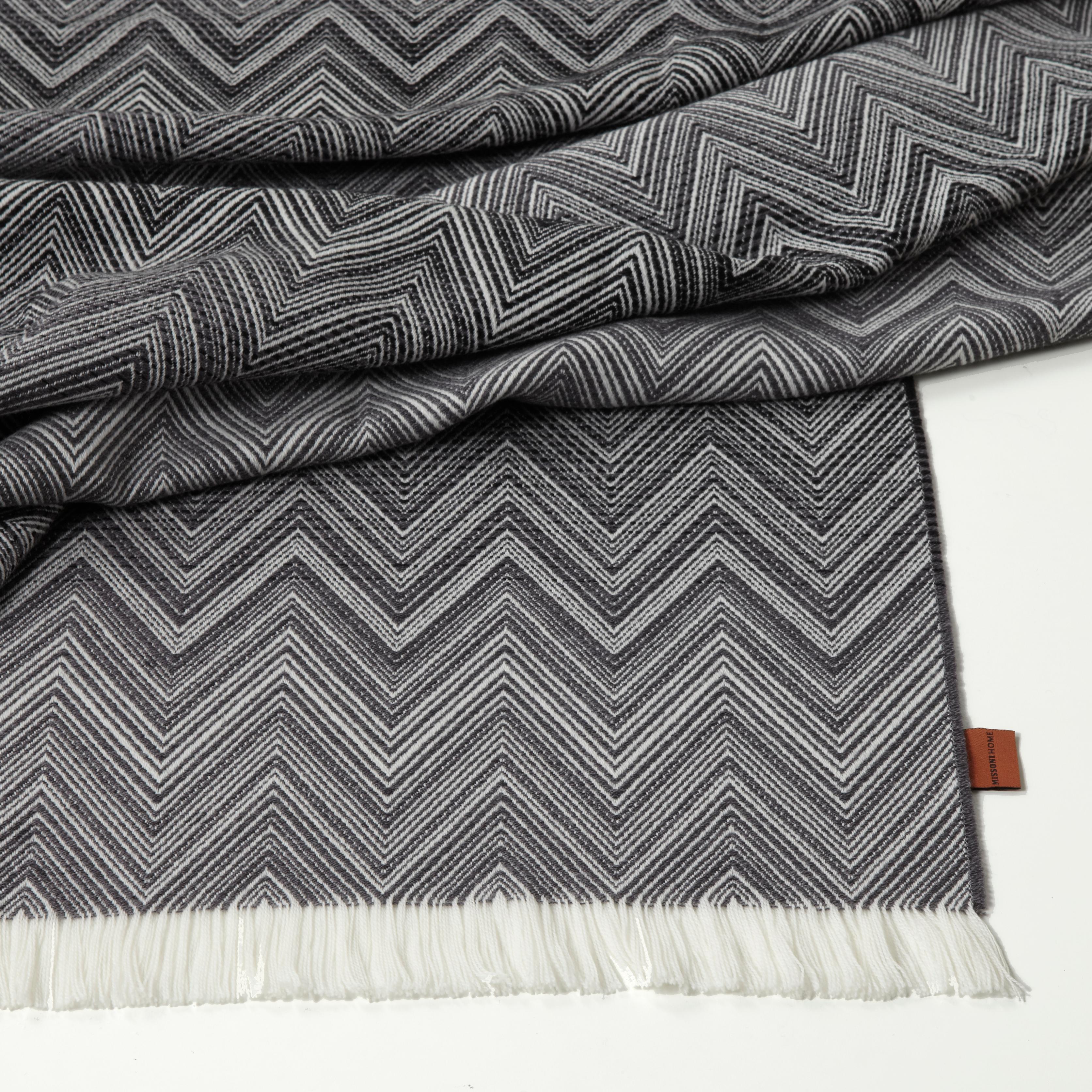 Missoni Home iconic chevron throw with a tonal ombre design. All Missoni Home products are custom made to order with the highest quality materials. Perfect for adding an elegant touch to any bedroom or living room.

Composition: 100% Wool. Care:
