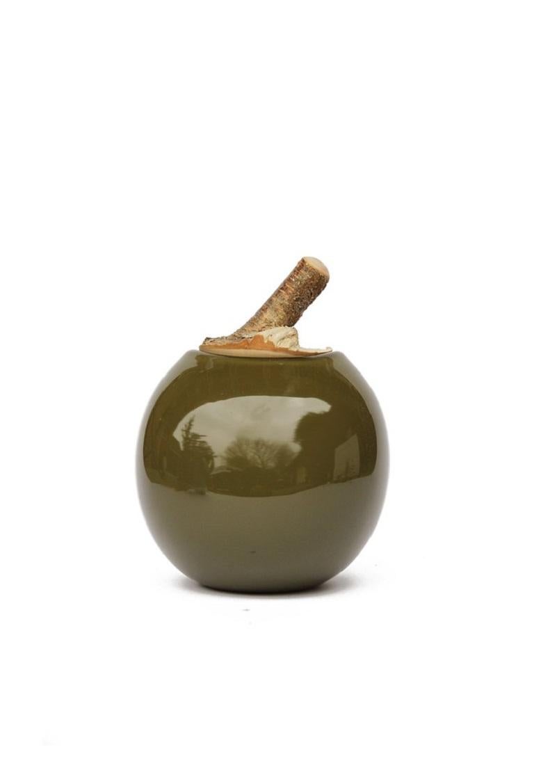 Mist Branch Bowl, Pia Wüstenberg
Dimensions: D 16-18 x H 20
Materials: glass, wood
Available in other colors.

A playful jar, with a lid made from a branch stub following the curvature of the glass. Branch Bowls are blown without a mould: their