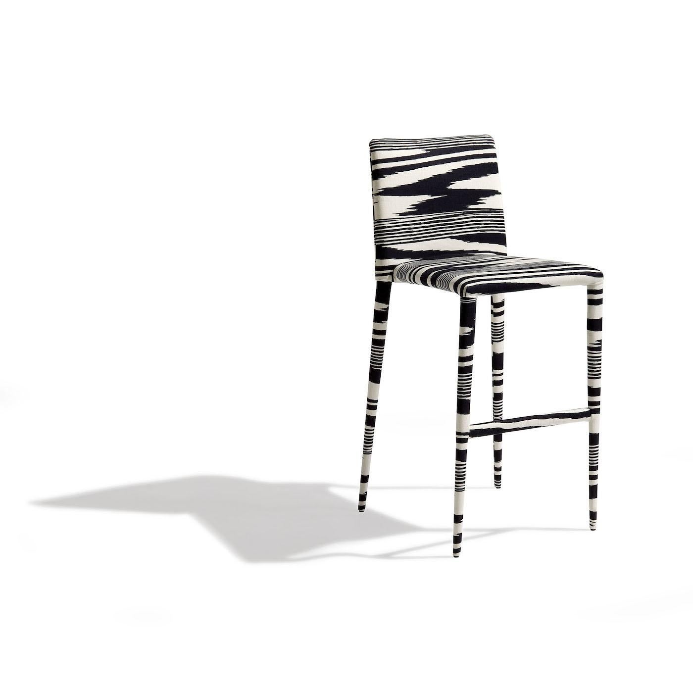 An endearing and comfortable combination of sleek frame and highly graphic pattern, this stool will be the perfect accent piece around a kitchen island or bar console in a modern, monochromatic interior. The frame is made of steel with multi-density