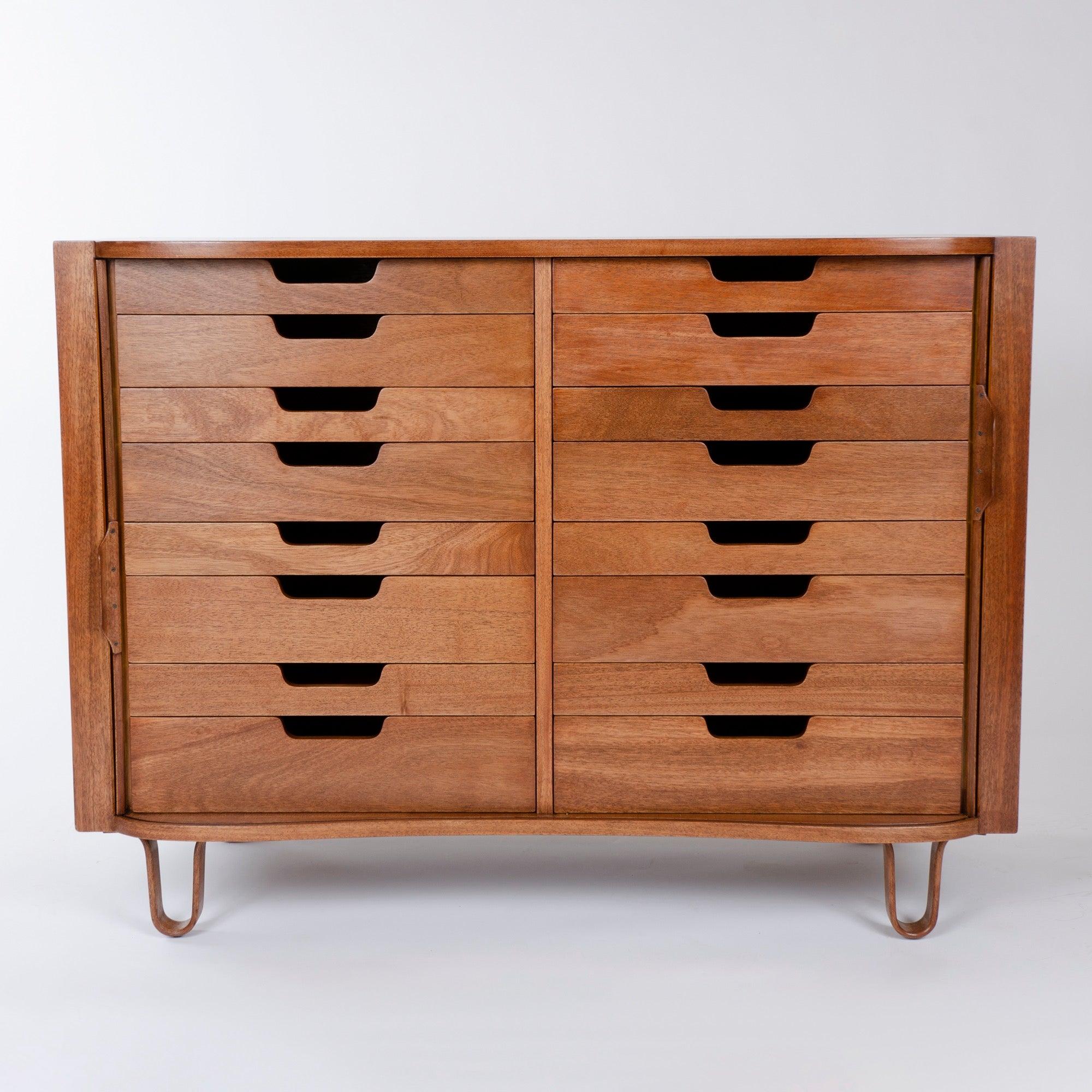 A superb mahogany tamboured Mister cabinet with an undulating face, expressive hairpin legs and a useful sixteen drawer configuration.