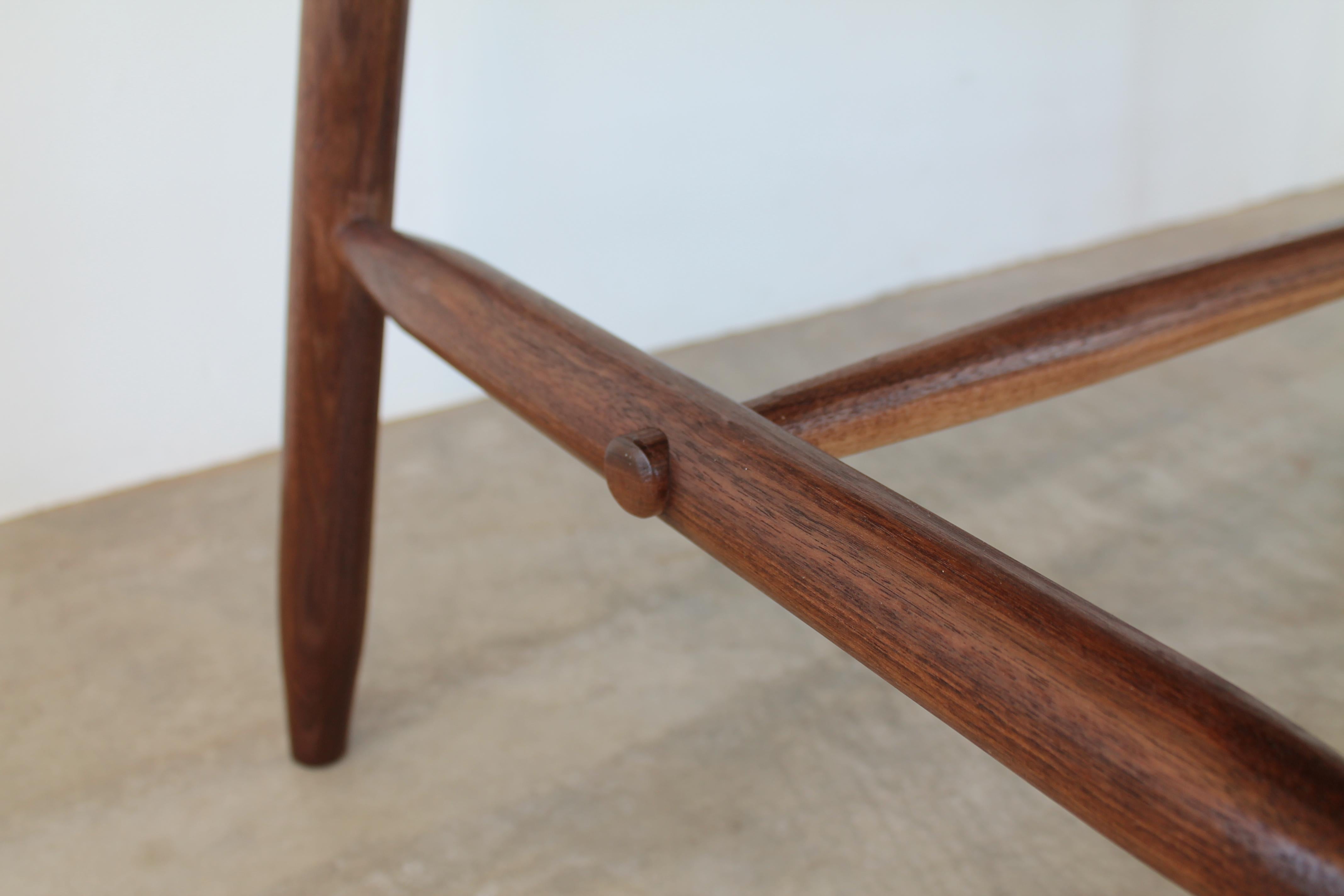 Mid-Century Modern Misterioso Dining Table in Walnut with Hand Shaped Base For Sale