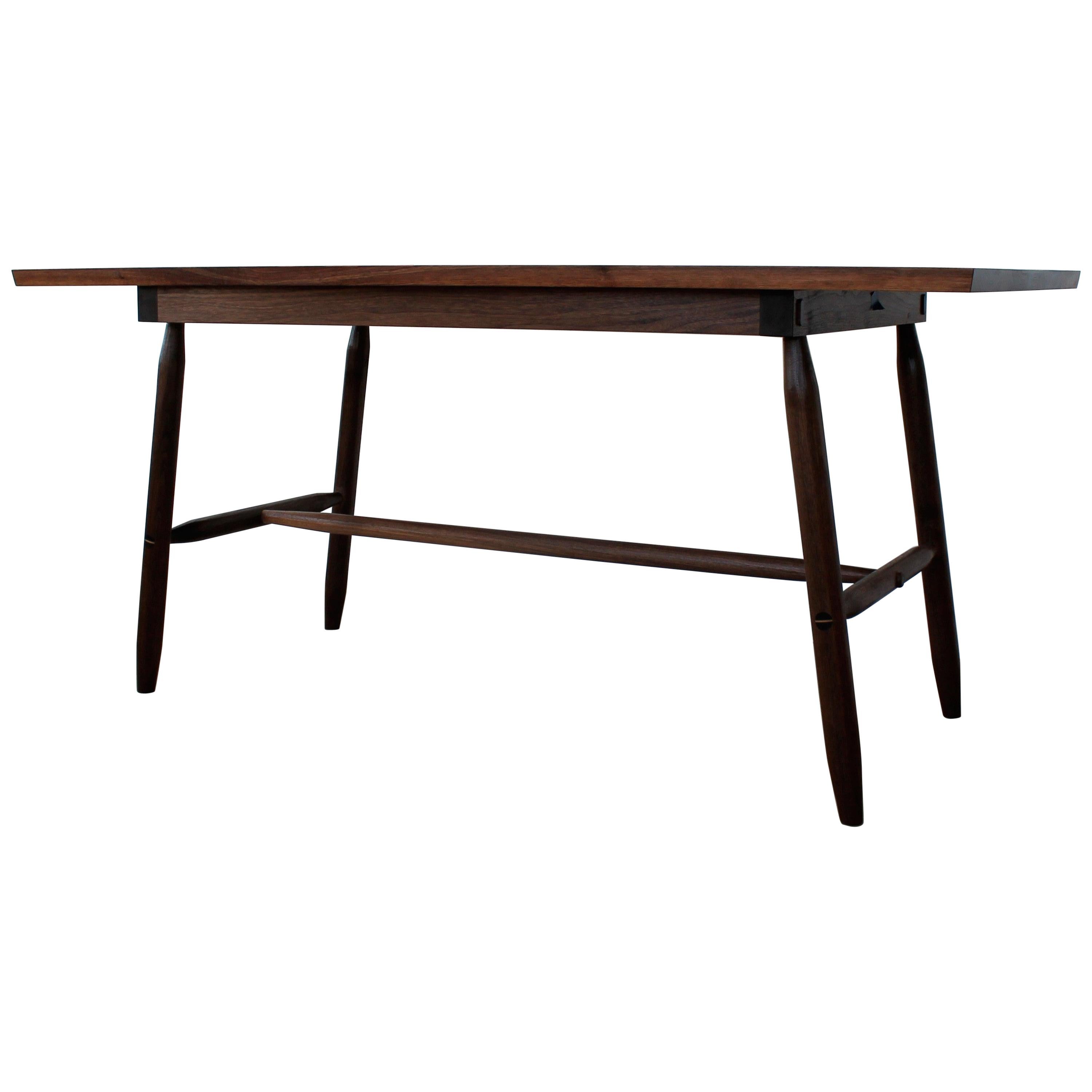 Misterioso Dining Table in Walnut with Hand Shaped Base For Sale
