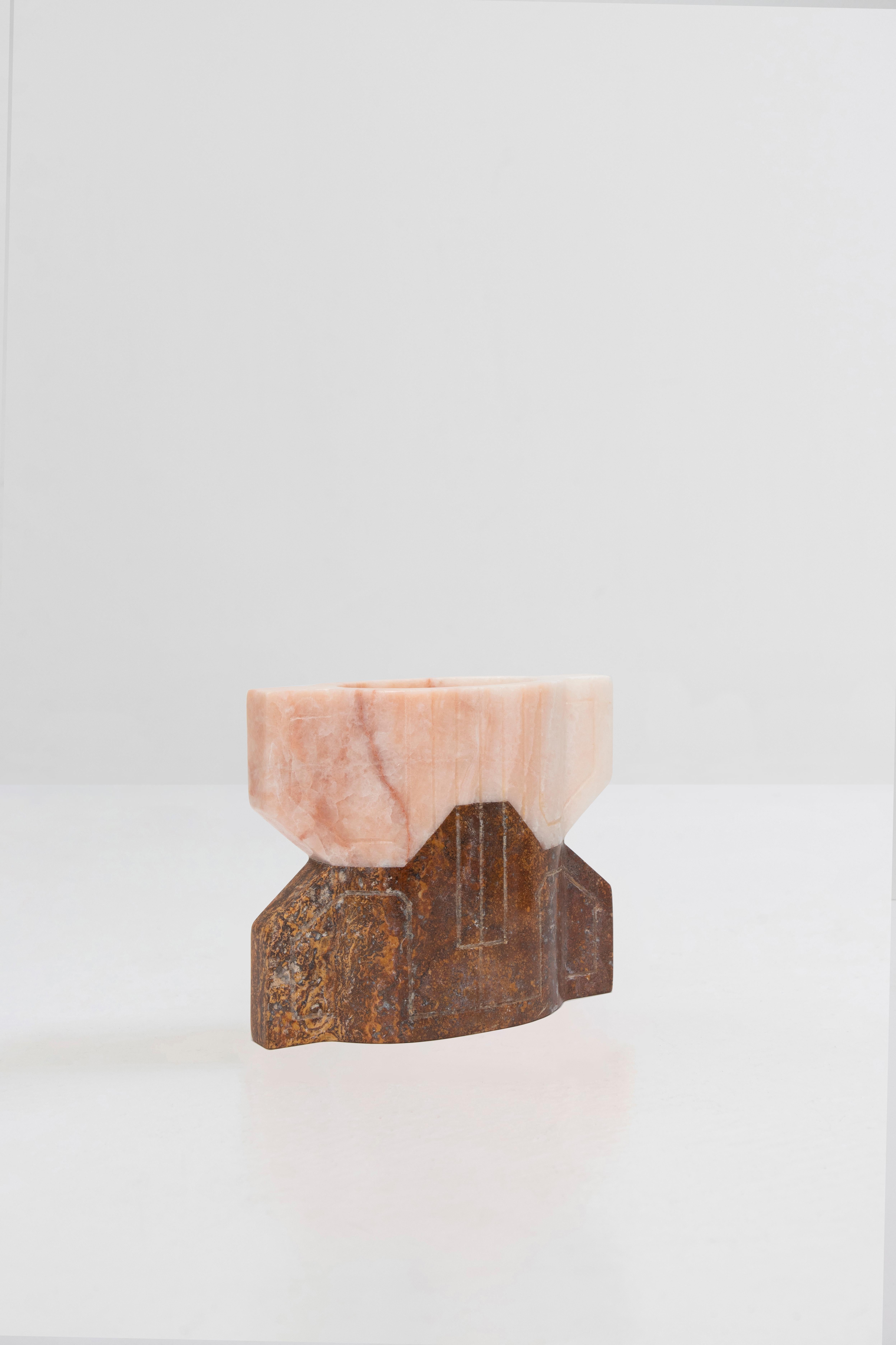 Pink onyx and red travertine
Edition of 10 + 2 AP

**As this work is made of natural stone, color and veins may vary from the photo**
Handcrafted in Mexico

The inspiration for these pieces draws deeply from the ancient and characteristic