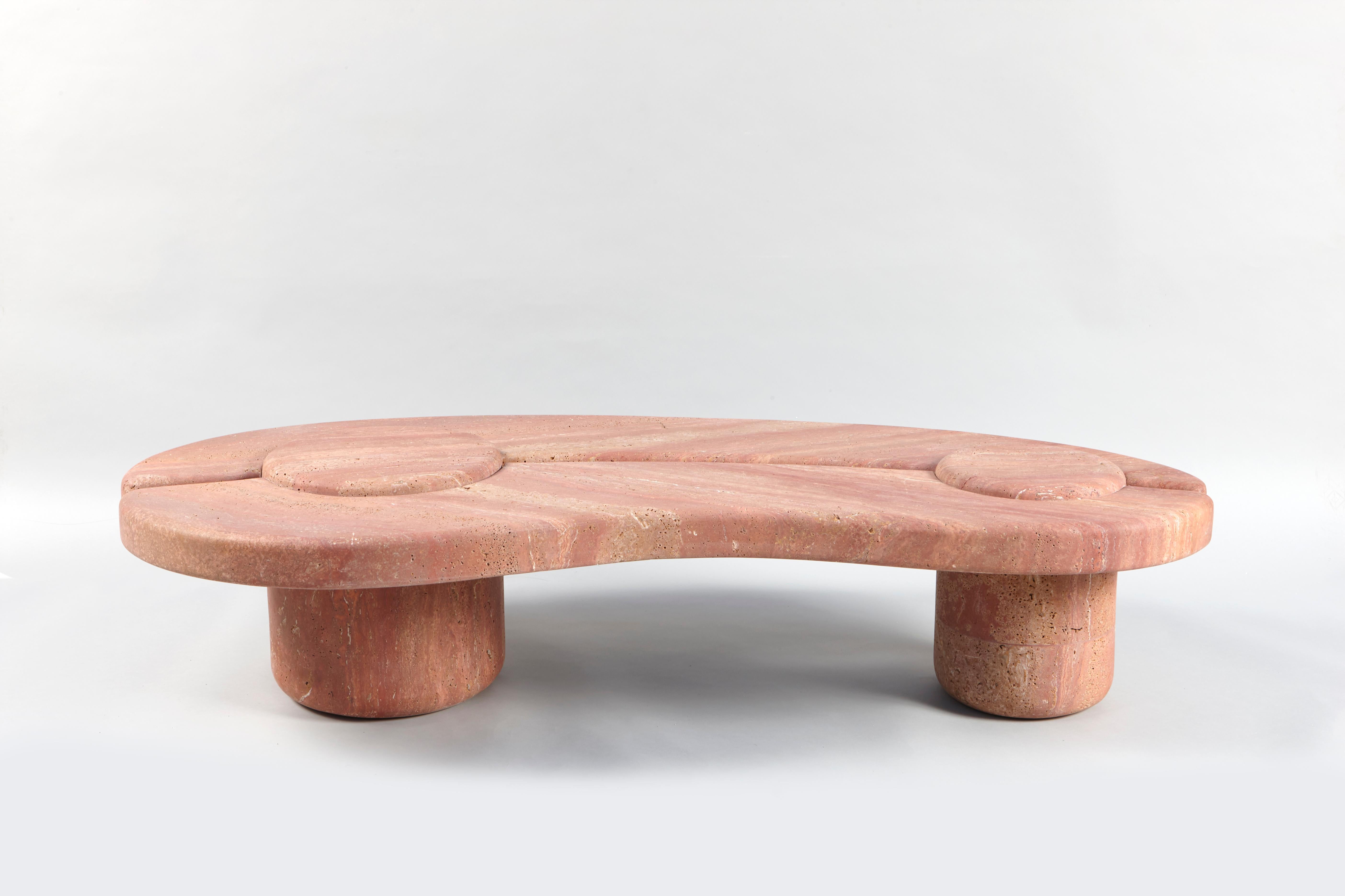 Mistral Coffee Table by Studio Bazazo
Dimensions: D 70 x W 160 x H 35 cm. 
Materials: Travertino Rosso and stainless steel.

Light as a breeze with the force to shape landscapes, the “Mistral” collection is a voyage to a moment of relief by the