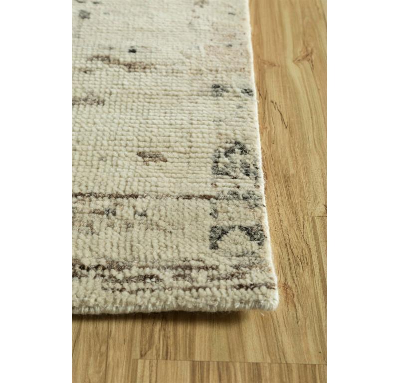 This exquisite rug from our Manifest collection is a celebration of nature's simplicity, showcasing an undyed white and natural mink color palette that exudes timeless sophistication. The intricate design features a harmonious blend of undulating