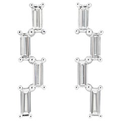 Misui Platinum Stud Earrings With 0.70 Carat White Diamond Baguettes