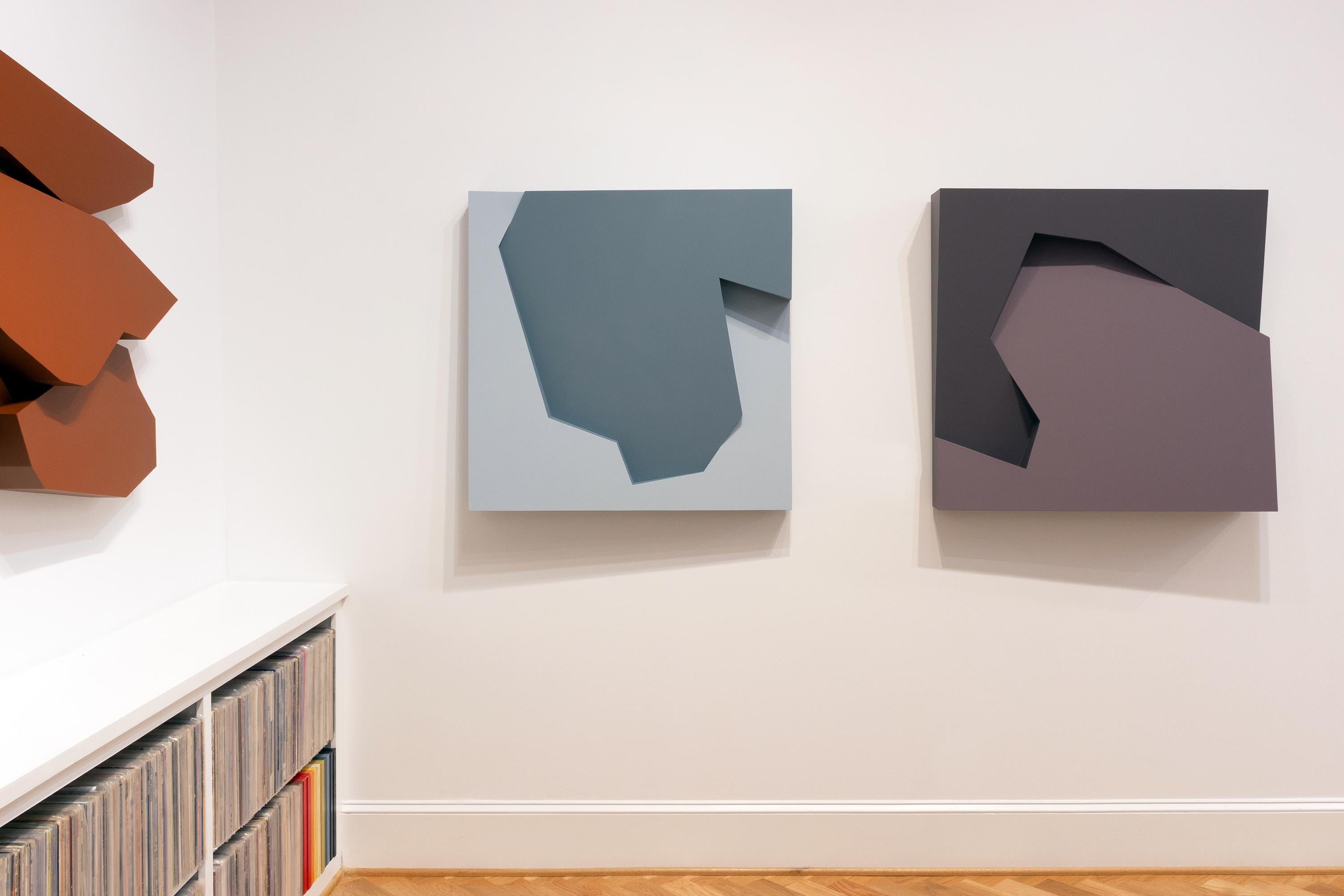 This geometric wall sculpture features blue hues. 

Atlanta-based artist Mitchell Biggio’s “Fault” is a series of complex three-dimensional wall sculptures that navigate the expansive interaction of shifting elements within our memories and frames