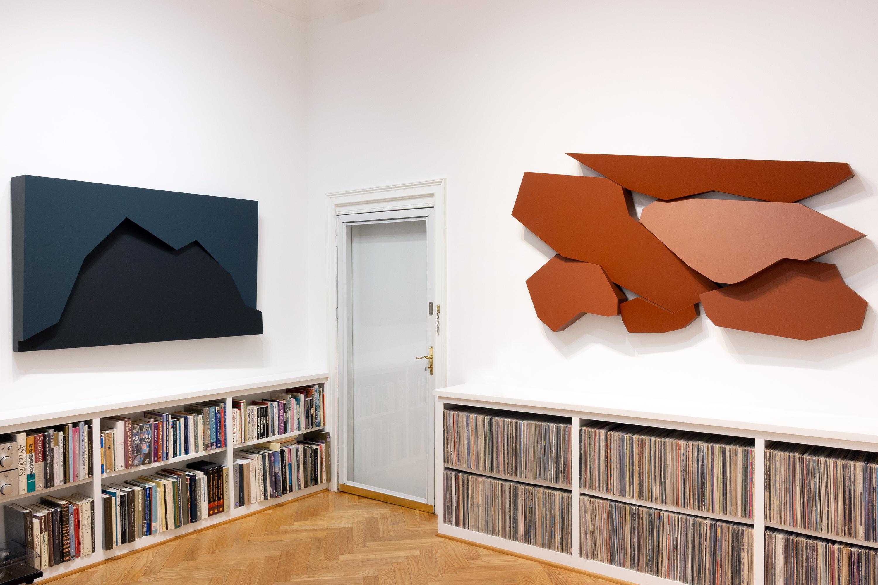 This geometric wall sculpture features blue hues. 

Atlanta-based artist Mitchell Biggio’s “Fault” is a series of complex three-dimensional wall sculptures that navigate the expansive interaction of shifting elements within our memories and frames