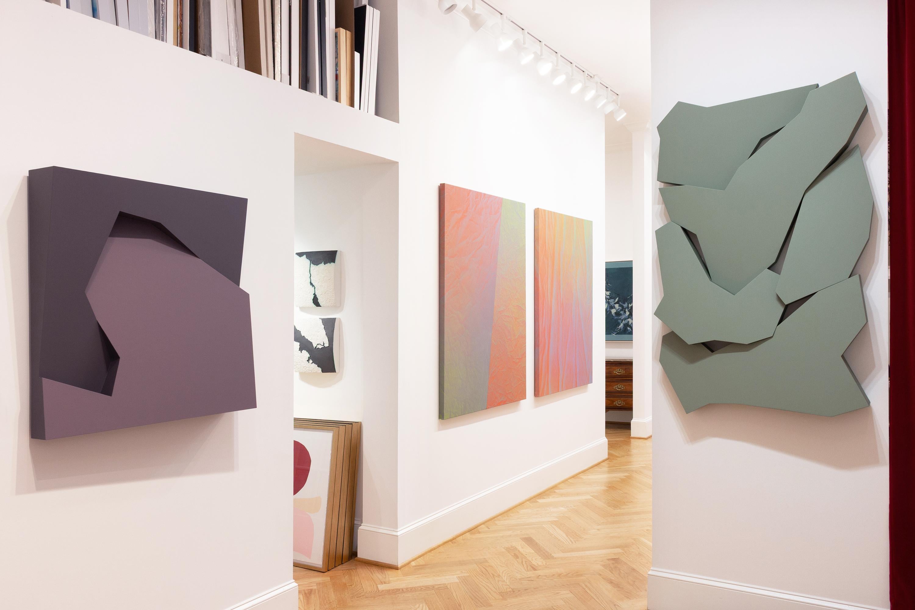 This geometric wall sculpture features green hues.

Atlanta-based artist Mitchell Biggio’s “Fault” is a series of complex three-dimensional wall sculptures that navigate the expansive interaction of shifting elements within our memories and frames