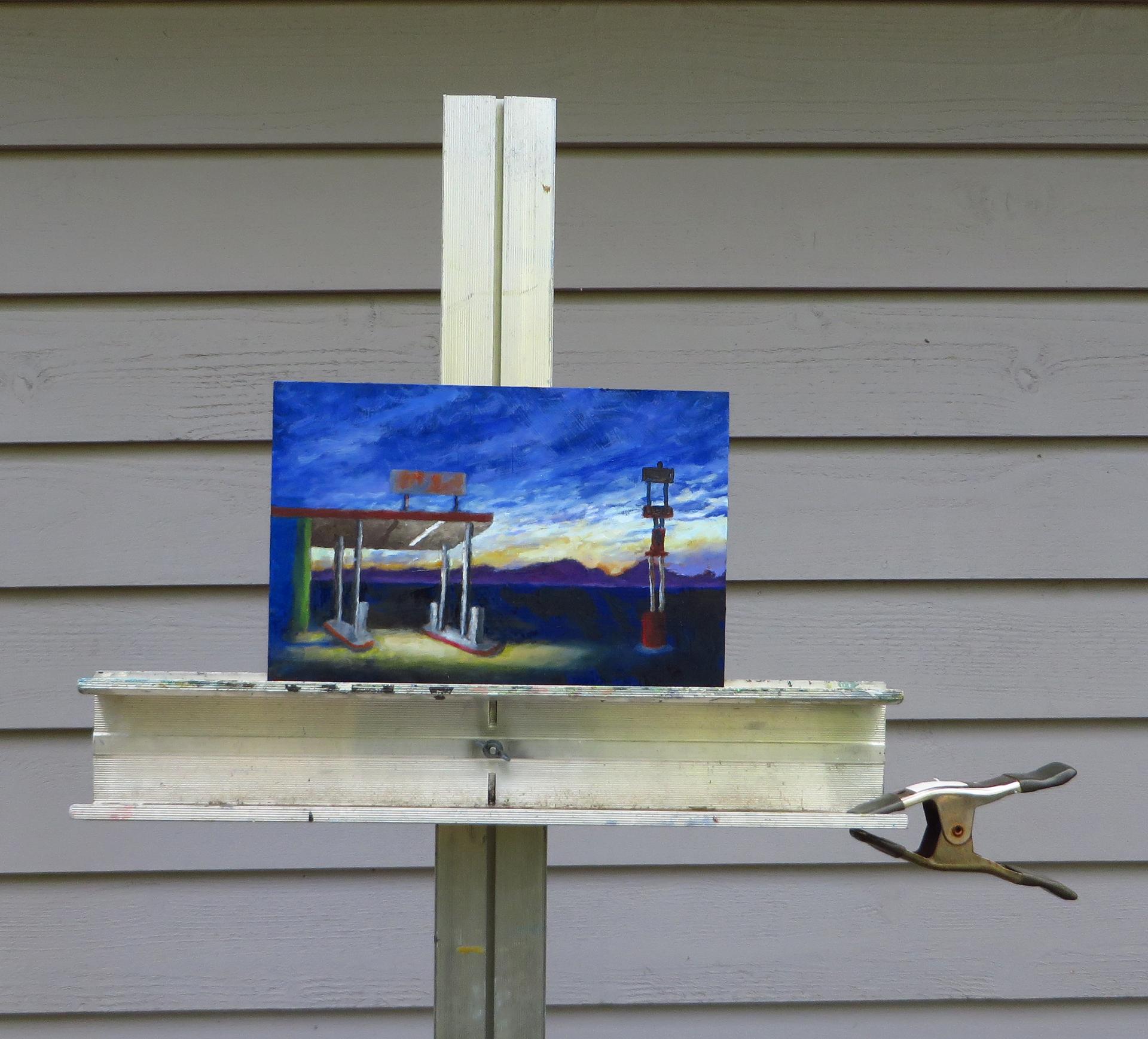 <p>Artist Comments<br>Dawn breaks over purple hills, warm sunlight spilling across the cool landscape. A gas station stands quiet along a long stretch of highway, waiting to open. Soon, drivers will stop to refuel, stretch their legs, and grab a